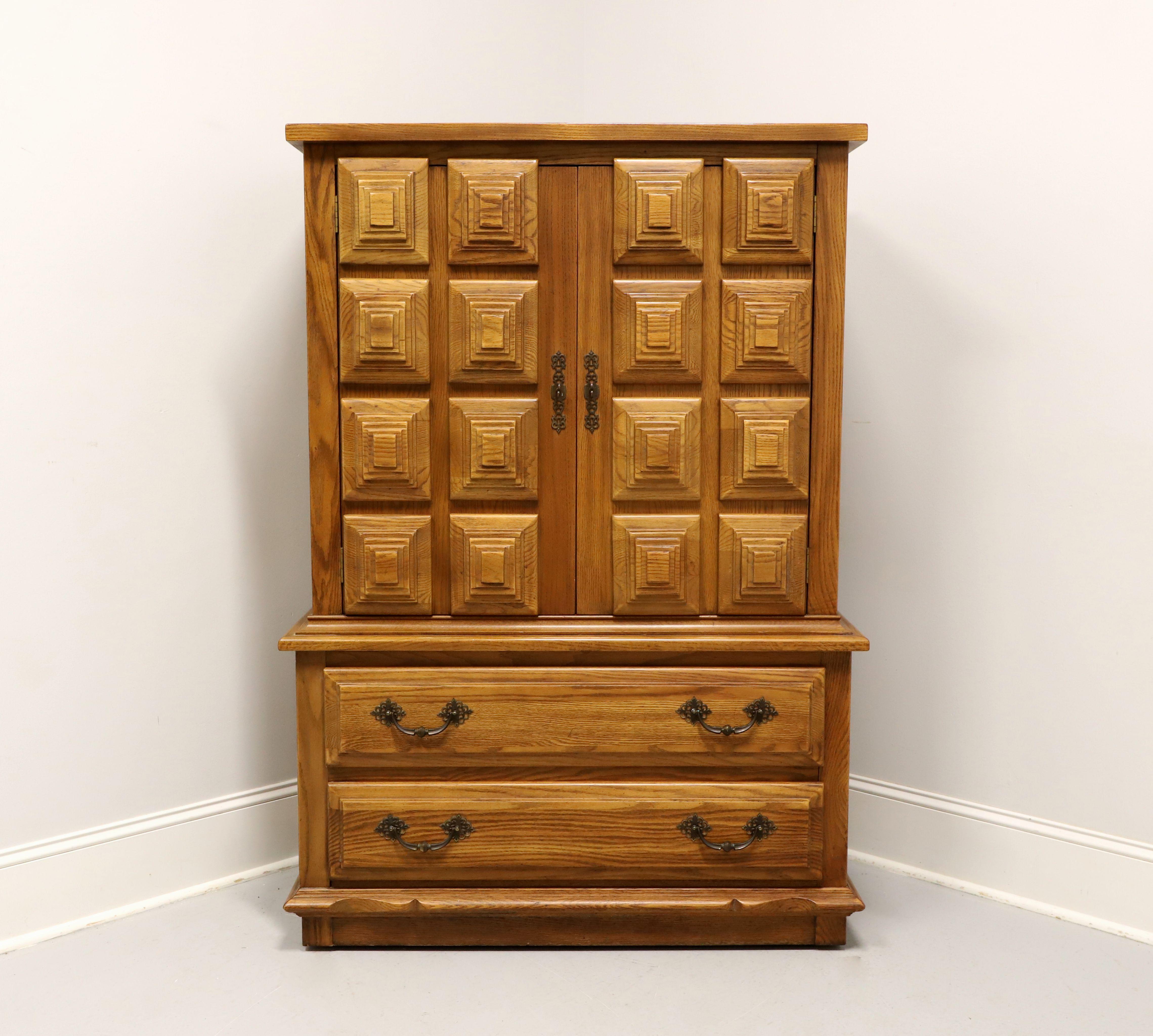 A Spanish Colonial style gentleman's chest by Link-Taylor, from their Espanol Collection. Solid oak with a lighter color slightly distressed finish, banded square edge top, brass hardware, raised & carved door fronts, and a decoratively carved solid