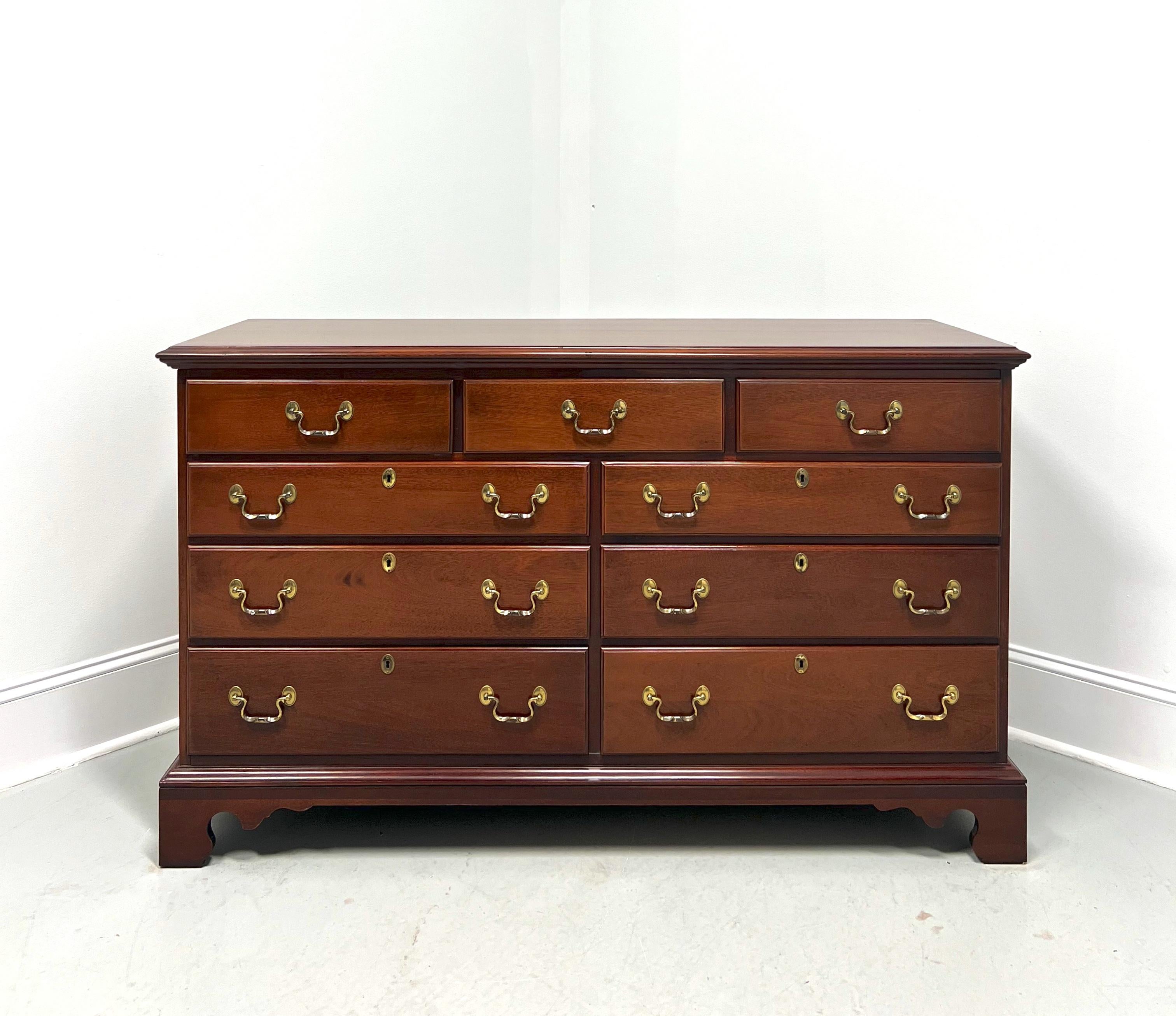 A Chippendale style double dresser by Link-Taylor, from their Heirloom Gallery, the Low Country. Solid mahogany with brass hardware, bevel edge to the top, and bracket feet. Features nine drawers of dovetail construction, six with faux keyhole