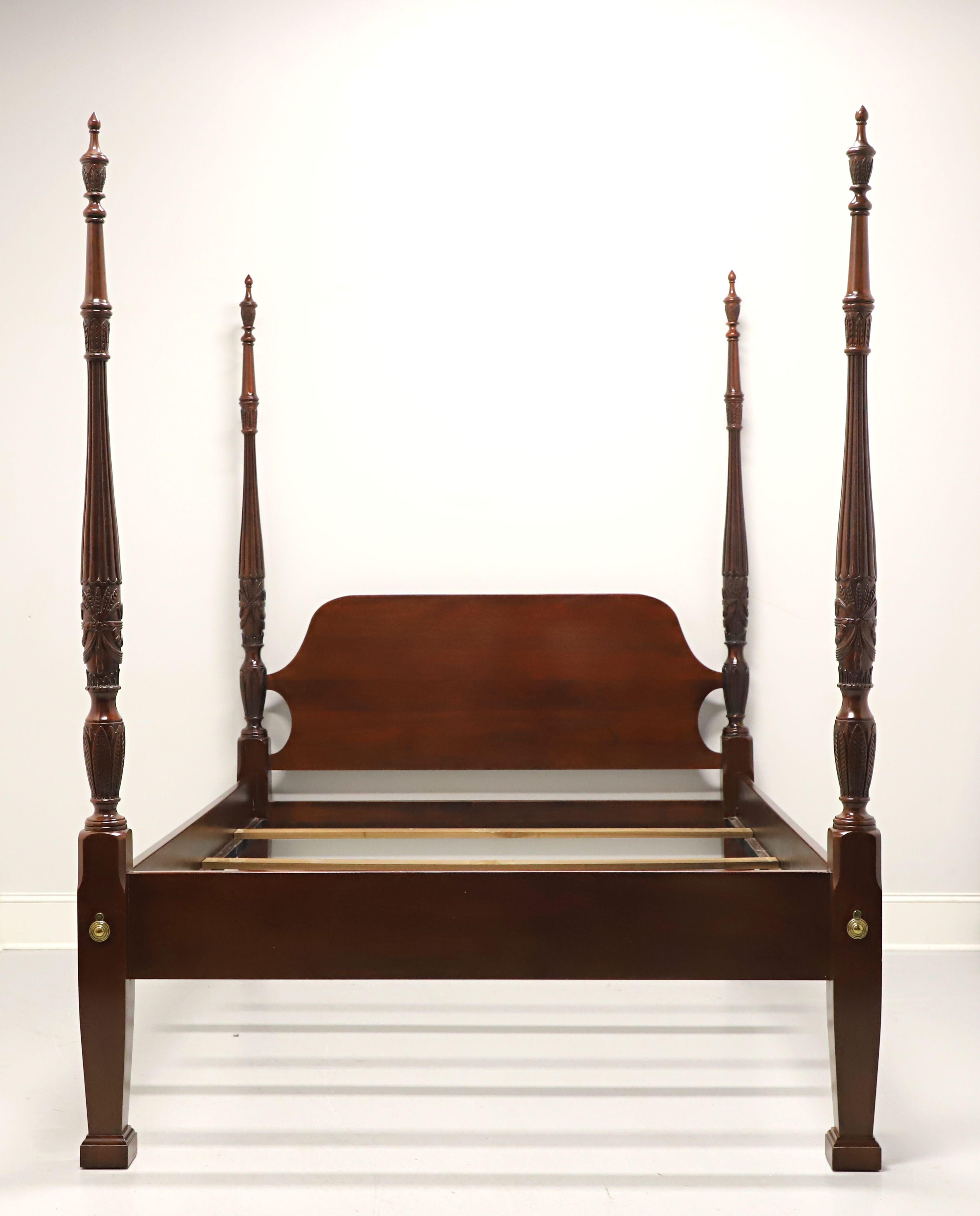 A Chippendale style queen size poster bed by Link-Taylor, from their Heirloom Gallery. Solid mahogany with arched headboard, low rail footboard, four rice carved posts with finials, brass hardware, bolt held side rails with wood bracers and three