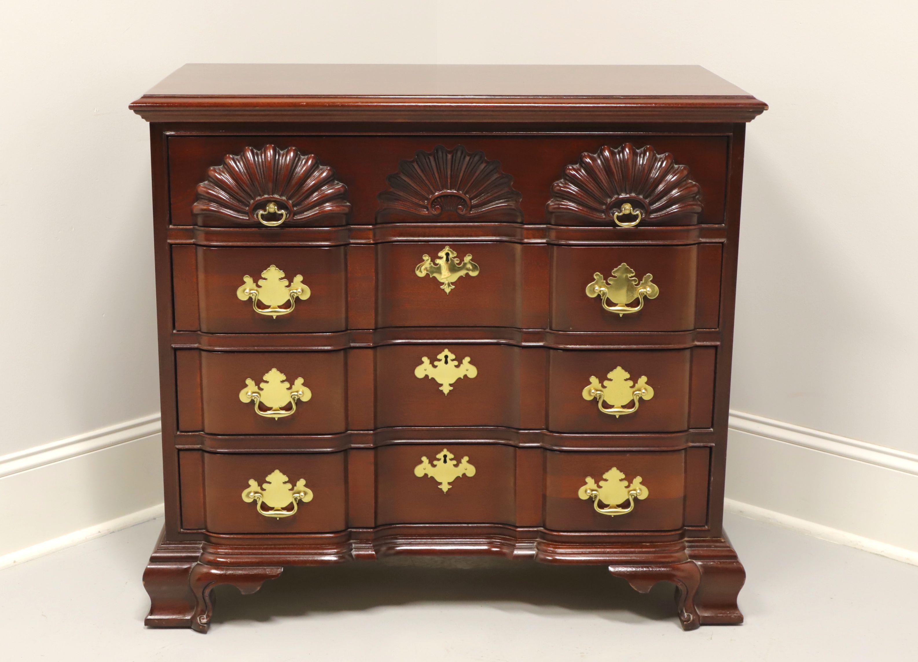 A rare find, a Chippendale Goddard style block front bachelor chest by Link-Taylor. Solid heirloom mahogany, brass hardware, block front, shell carvings to top drawer and ogee bracket feet. Features four drawers of dovetail construction with three