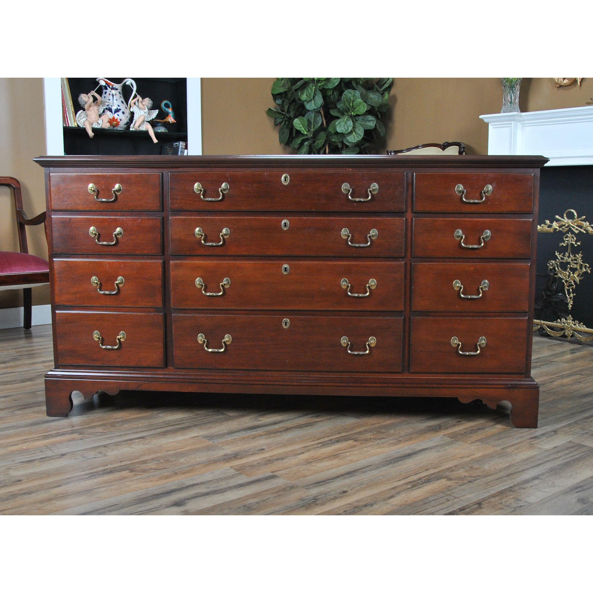 A vintage link-taylor solid mahogany triple dresser produced from solid mahogany. A classic furniture shape this chest features three drawers across the width of the chest and gradually larger drawers through the height of the piece giving this