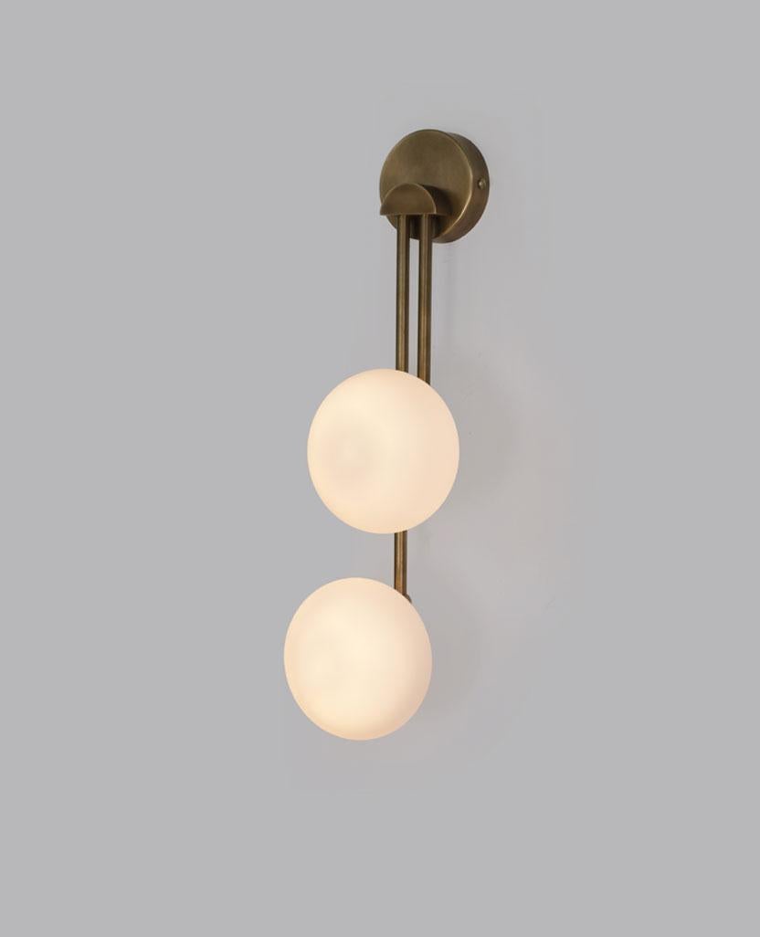 Link Two Glass Globe Wall Sconce by Lamp Shaper
Dimensions: D 13.5 x W 11.5 x H 46 cm.
Materials: Brass and glass.

Different finishes available: raw brass, aged brass, burnt brass and brushed brass Please contact us.

All our lamps can be wired