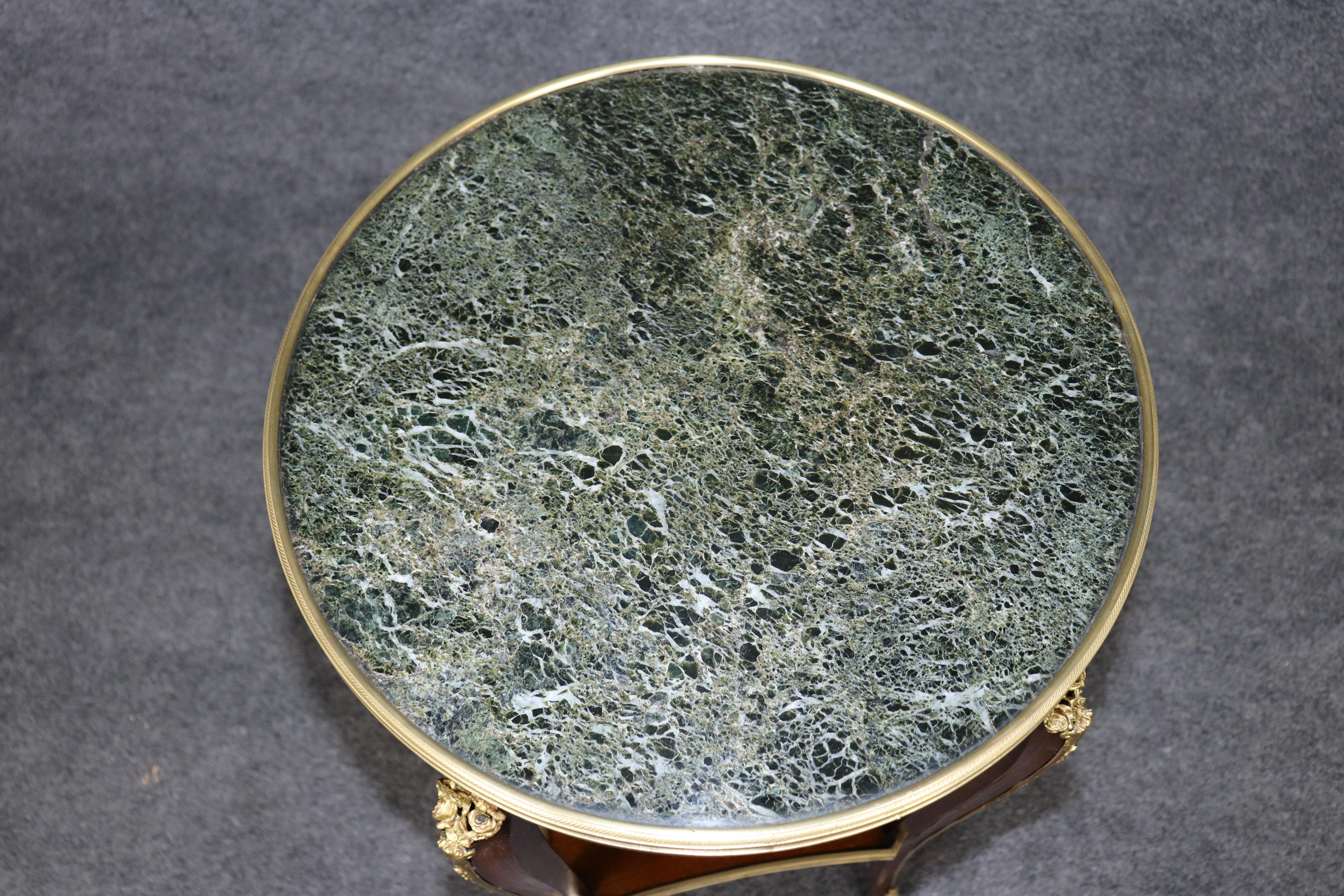 This is an extraordinary table. Designed in the Louis XV style, this French-made table can be used as an occasional table or end table. The table features jewelry quality castings in the quality of Francois Linke. The table is absolutely superb and
