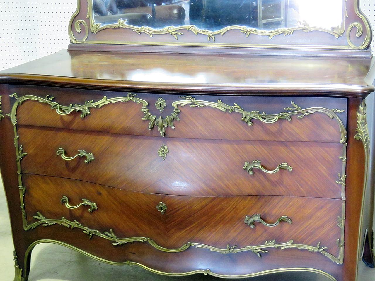 Linke style 3-drawer commode with mirror and bronze mounts. The commode measures 34