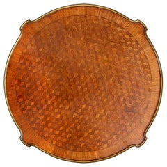 Linke style Gueridon, with parquetry inlay and gilded ormolu mounts.