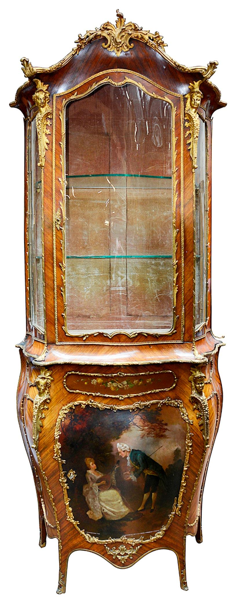 A very good quality late 19th century French verni martin vitrine. Having gilded ormolu monopodia and scolling foliate mounts, The serpentine sides and fronted glazed door opening to reveal glass shelves within. The single door having a hand painted