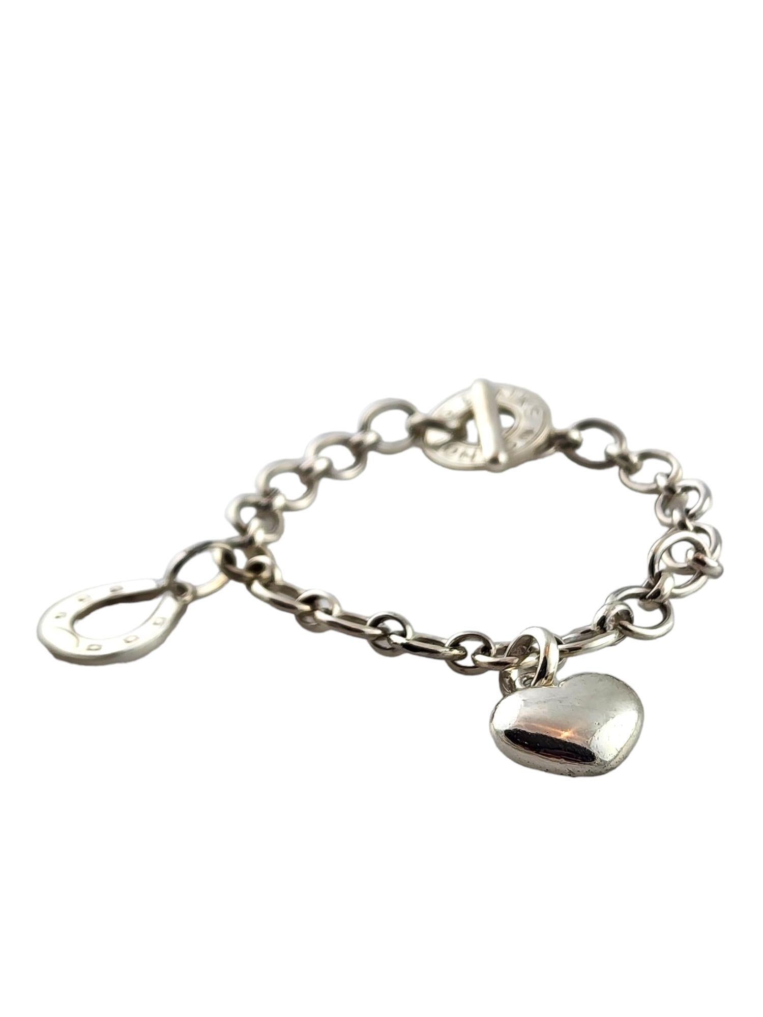 Links of London Sterling Silver Heart & Horseshoe Charm Bracelet

This beautiful Links of London toggle charm bracelet was meticulously crafted from sterling silver and features one puffy heart charm and one horseshoe charm!

Size: 6.75