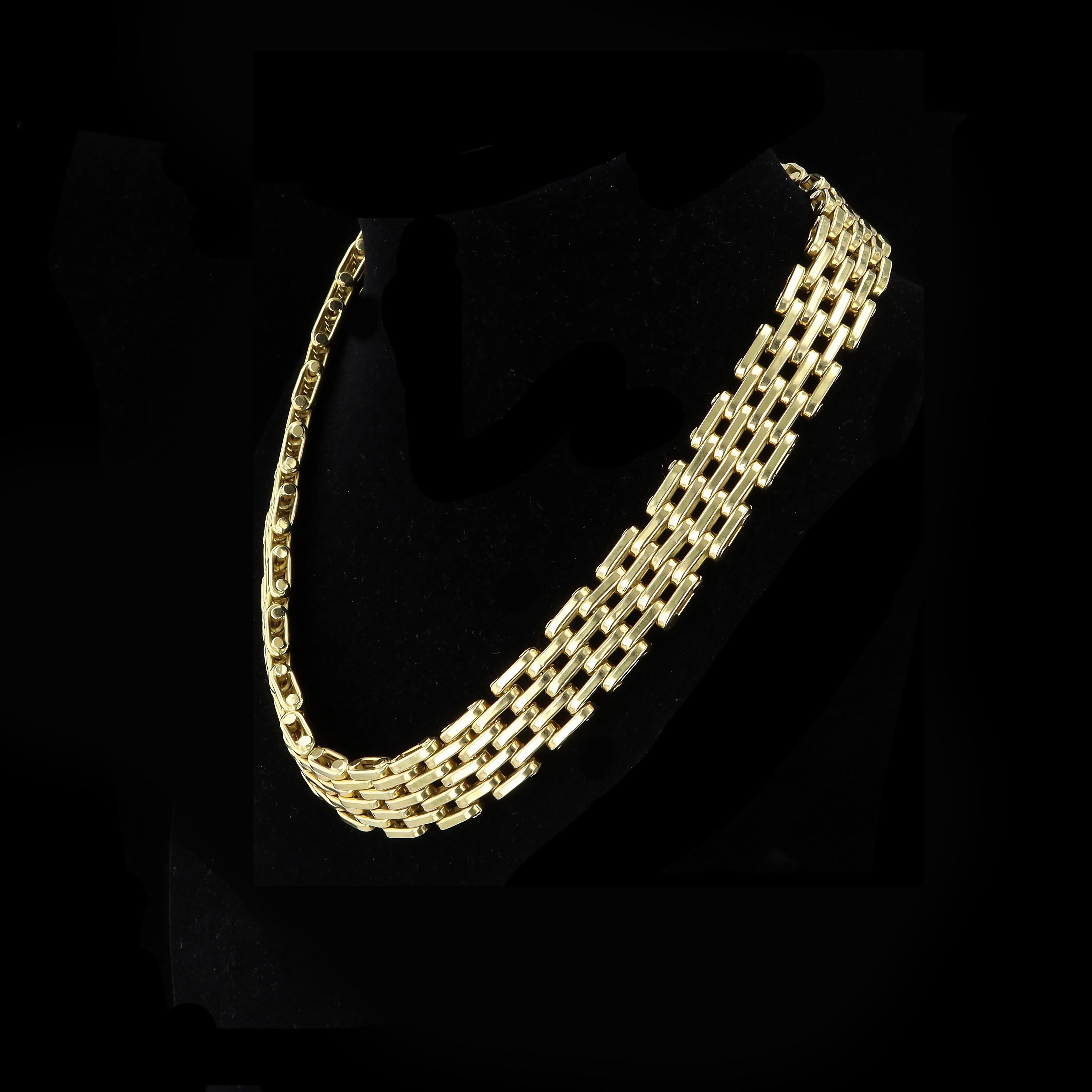 Layers and layers of links are blended together in a stunning 18K yellow gold statement. The multi link chain necklace measures 18 inches in length and 16.5mm in width. The necklace is stamped 750 and weighs 76.4 grams.

