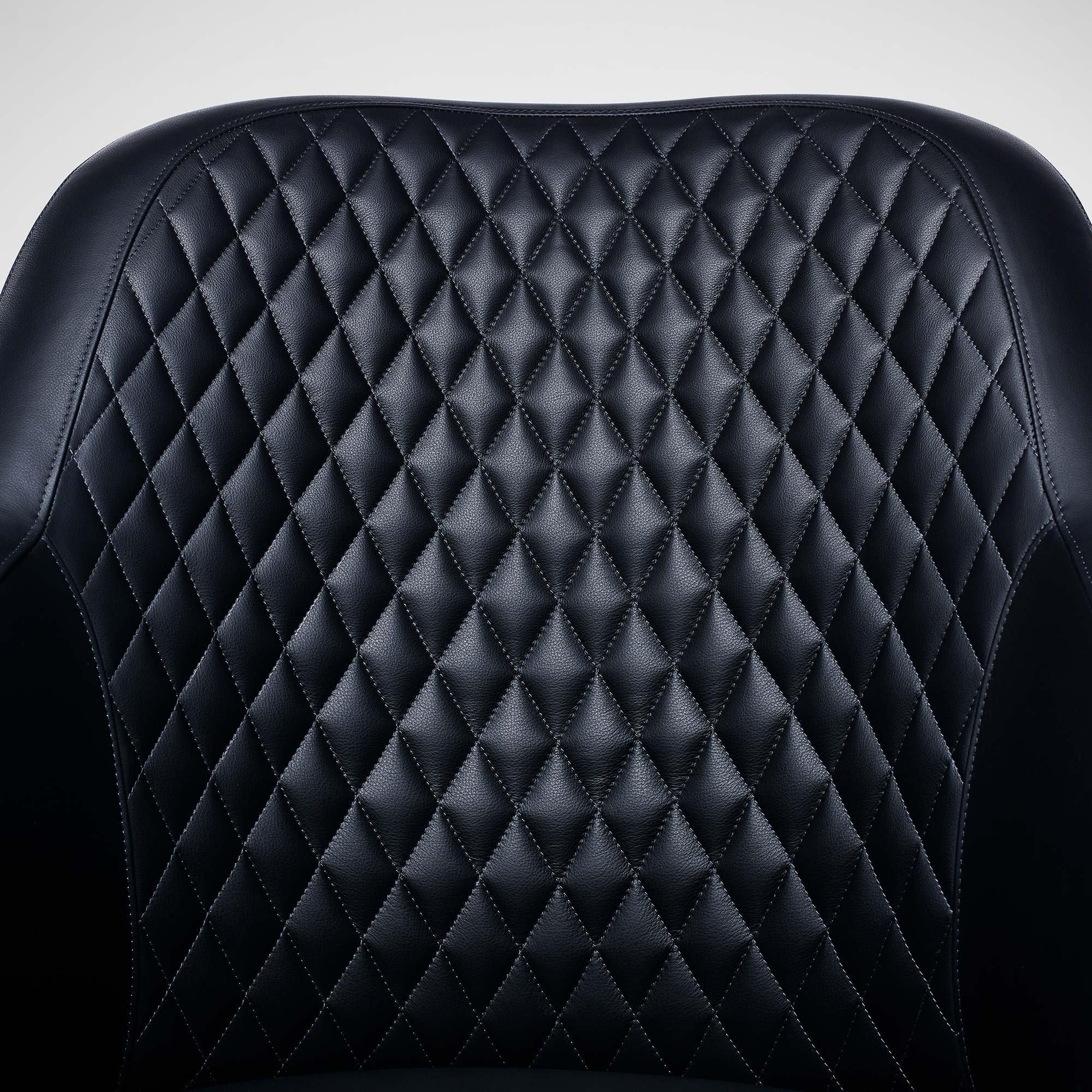 The classic office chair receives a contemporary LINLEY twist with the Riviera Quilted desk chair. Structured and formal but reassuringly comfortable and practical, this chair features walnut armrests and titanium swivel legs elegantly finished with