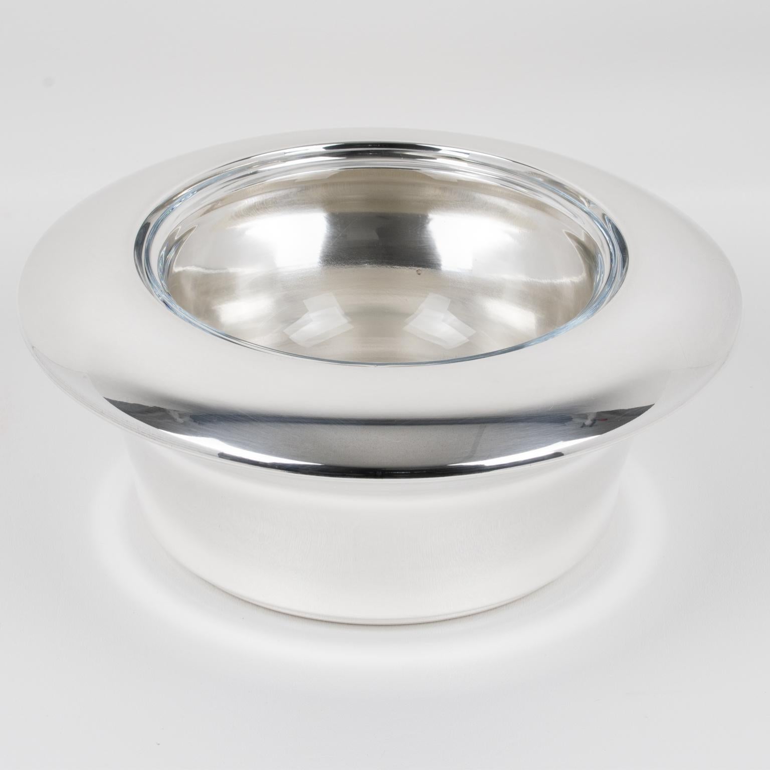 Lino Sabattini designed this modernist silver plate and crystal caviar serving bowl, dish, or chiller in the 1980s. The sophisticated design boasts a streamlined geometric shape, featuring a rounded silver-plated metal ice container with a ring lid