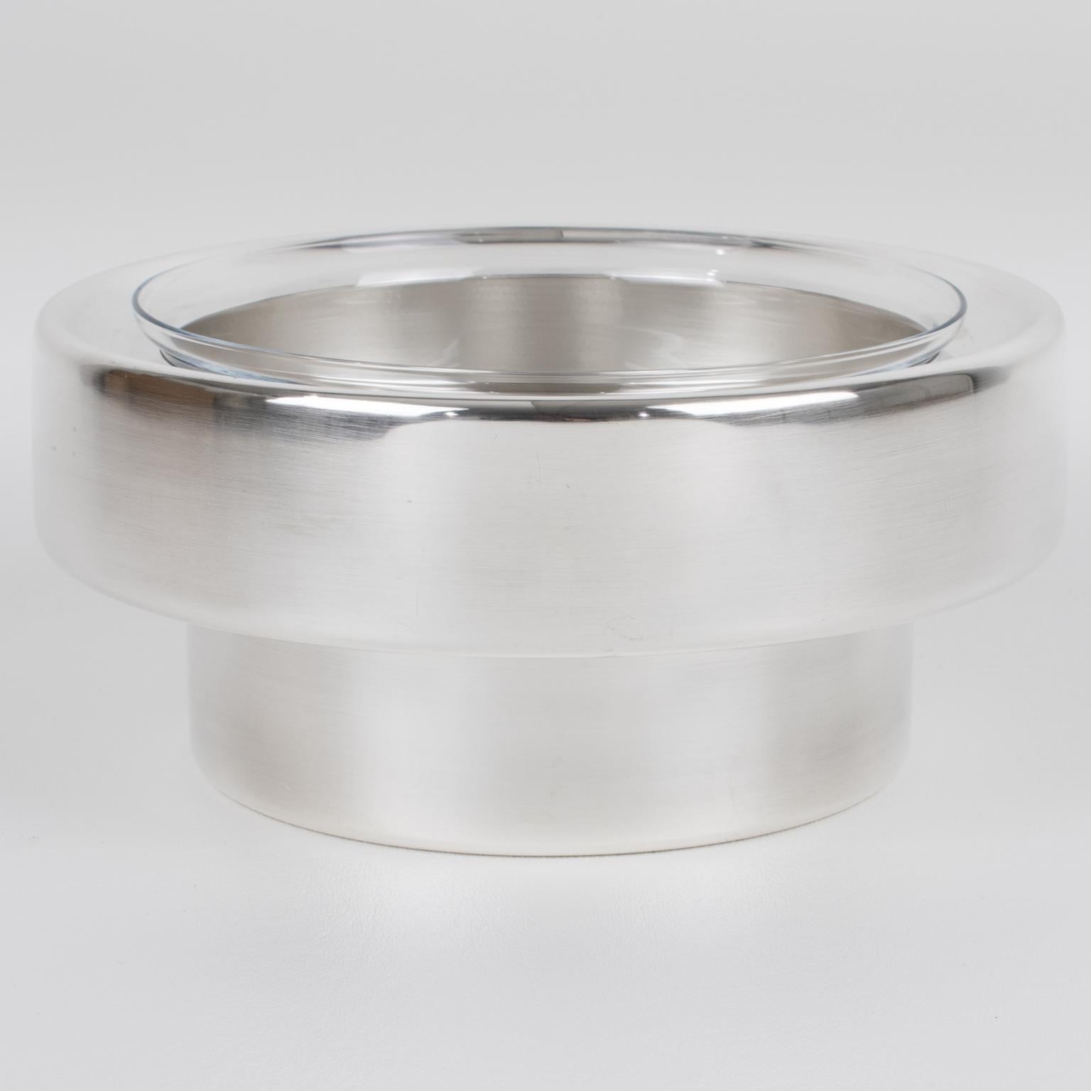 This lovely silver plate and crystal caviar serving bowl, dish, or chiller was designed by Lino Sabattini in the 1980s. The minimalist modern design with a streamlined geometric shape features a rounded silver-plated metal ice container and a