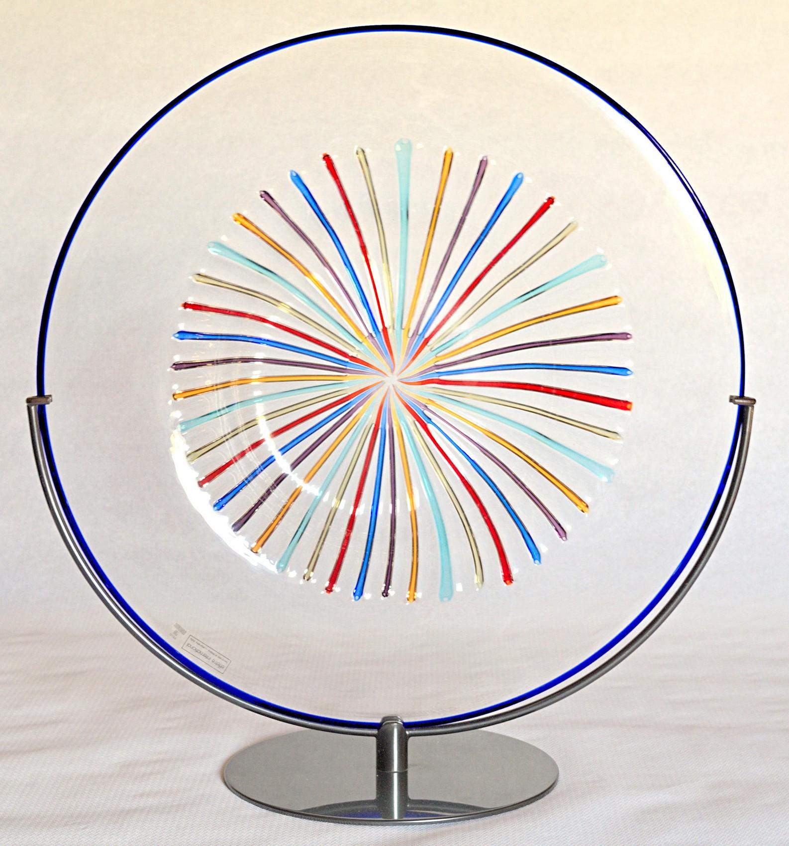 Original Lino Tagliapietra charger with original stand, 1986. Rare and unique. Part of the rainbow collection created at Effetre International in the mid-1980s.
Designed in collaboration with Marina Angelin 1982-1986.

Charger/plate, hand opened