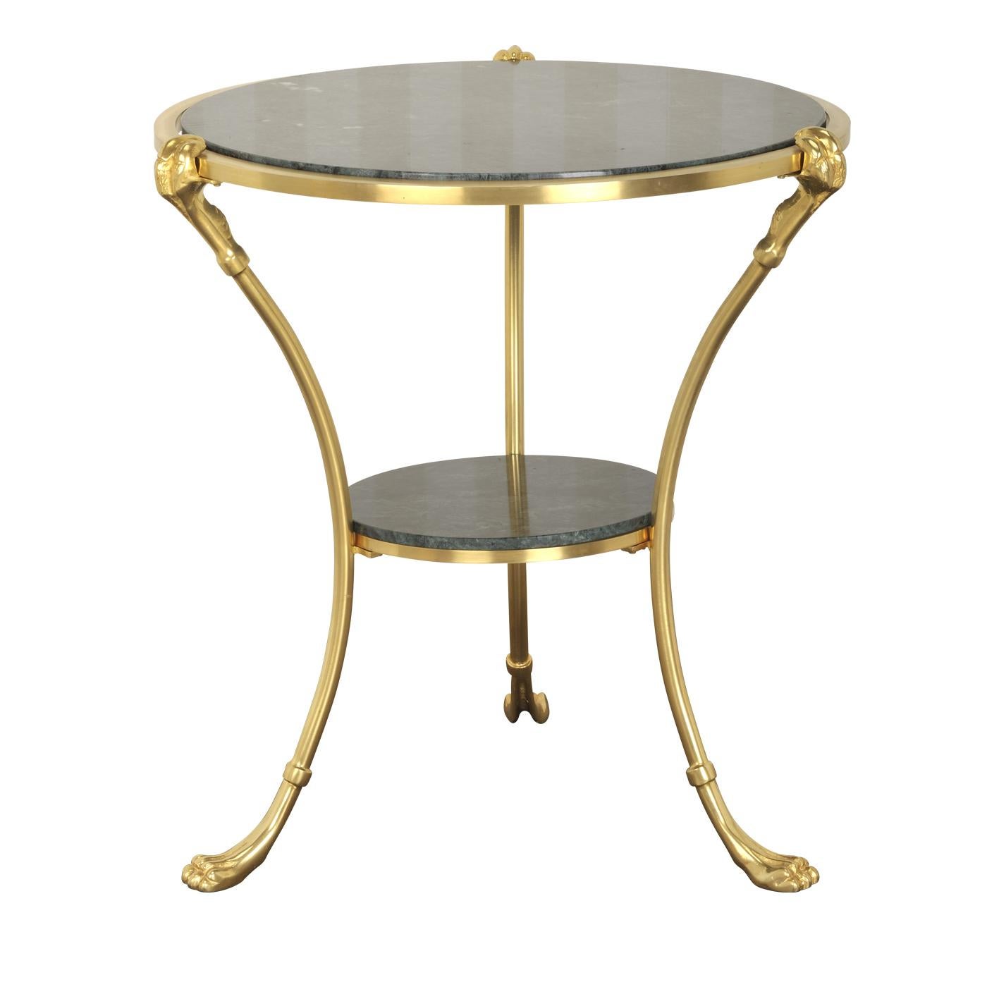 This striking coffee table exudes Classic sophistication, thanks to its three sinuous and slender legs in bronze with a gold finish, each ending with an exquisite lion paw. The two layers of its round top are in green Alps marble. This piece is a