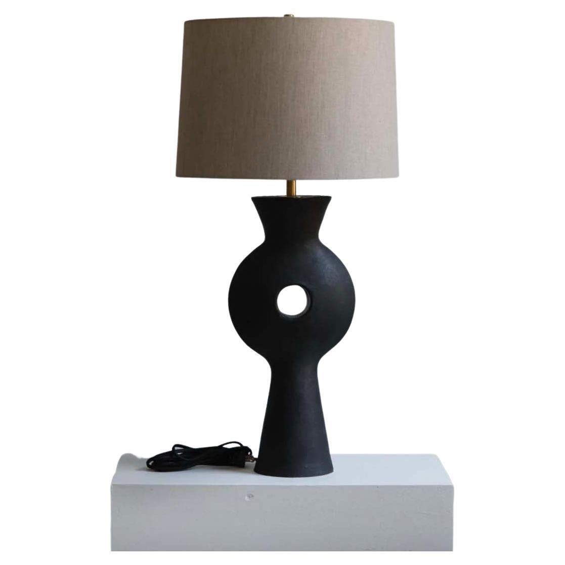 The Linus lamp is handmade studio pottery by ceramic artist by Danny Kaplan. Shade included. Please note exact dimensions may vary.

Born in New York City and raised in Aix-en-Provence, France, Danny Kaplan’s passion for ceramics was shaped by early