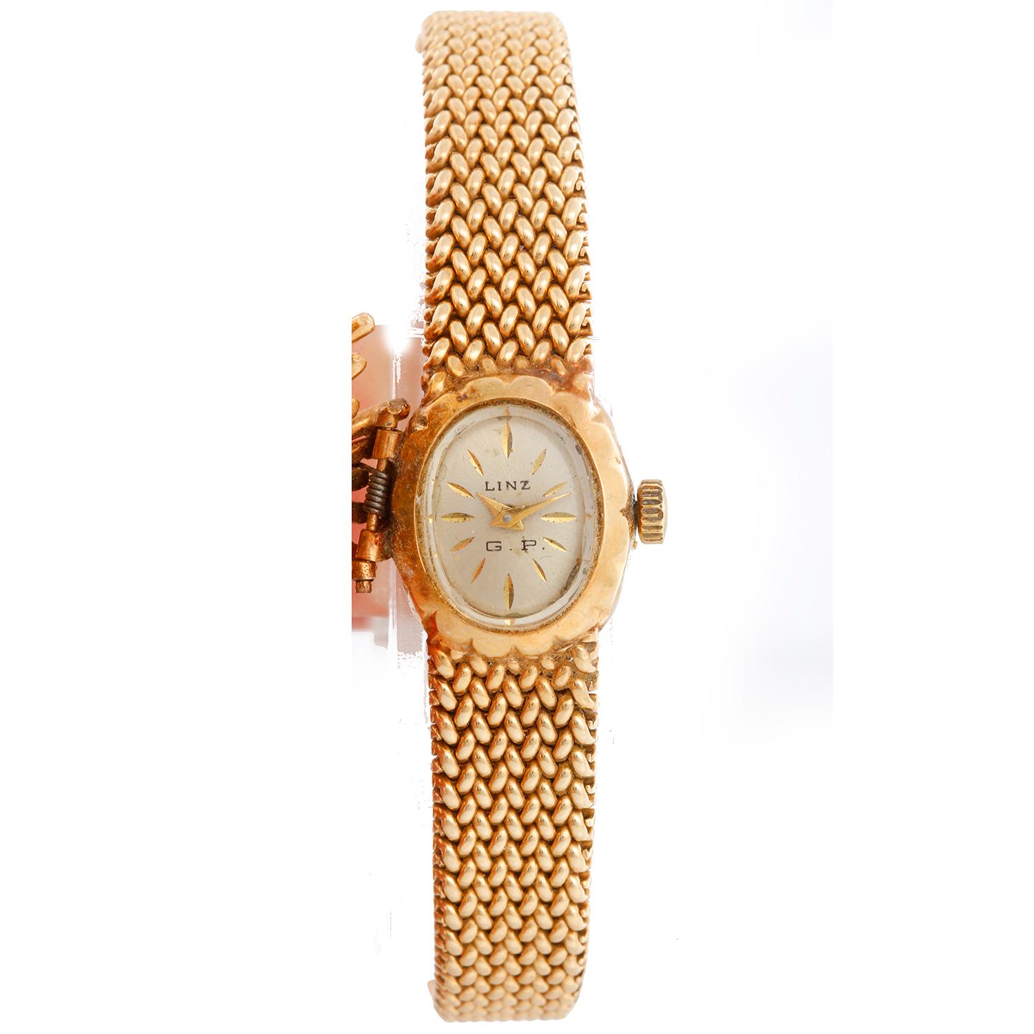 Linz 14K Yellow Gold Vintage Watch - Manual winding. 14K yellow gold with a diamond case ( 22 x 32mm ). Silver dial with gold hour markers . 14K Yellow gold bracelet; will fit up to a 6 1/2 inch wrist. Pre-owned with custom box.