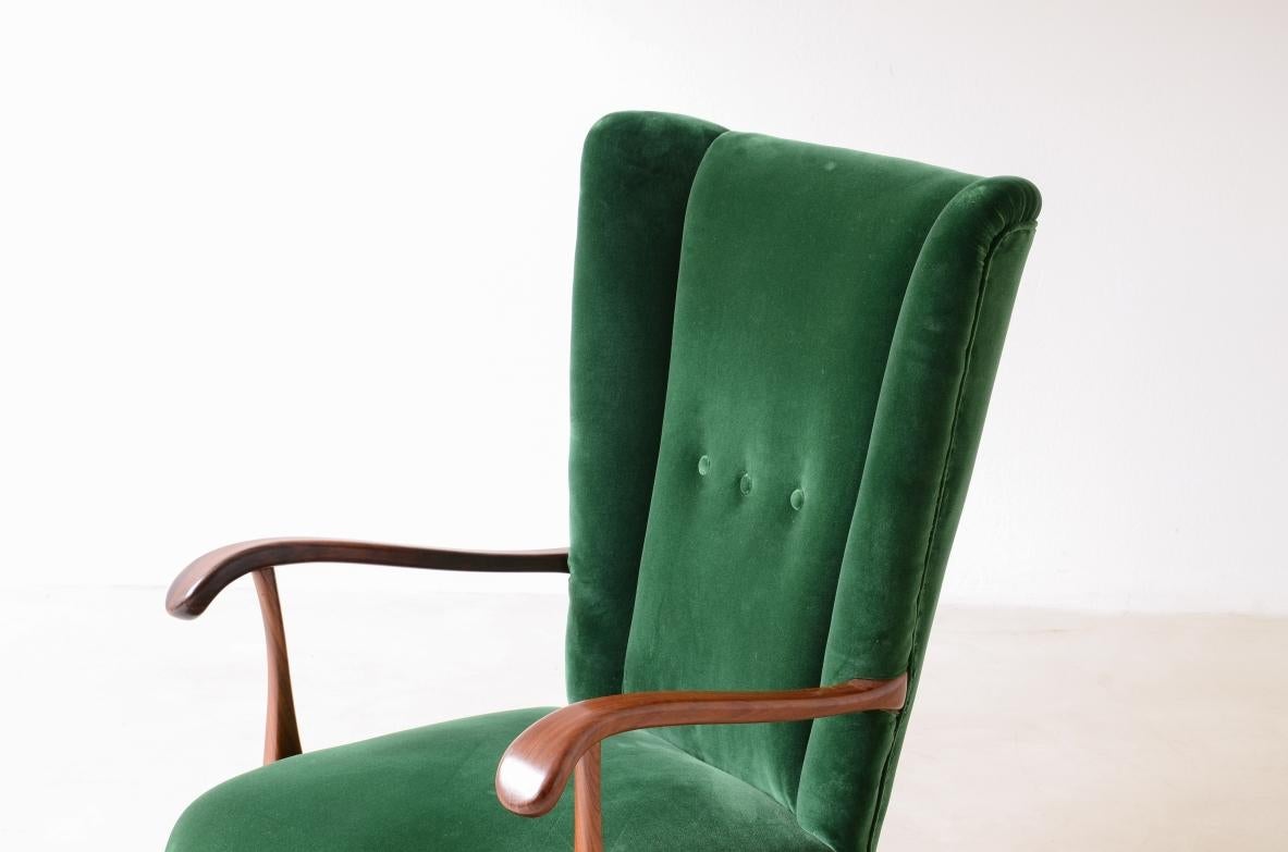 Italian Lio Carminati, elegant armchair in shaped wood For Sale