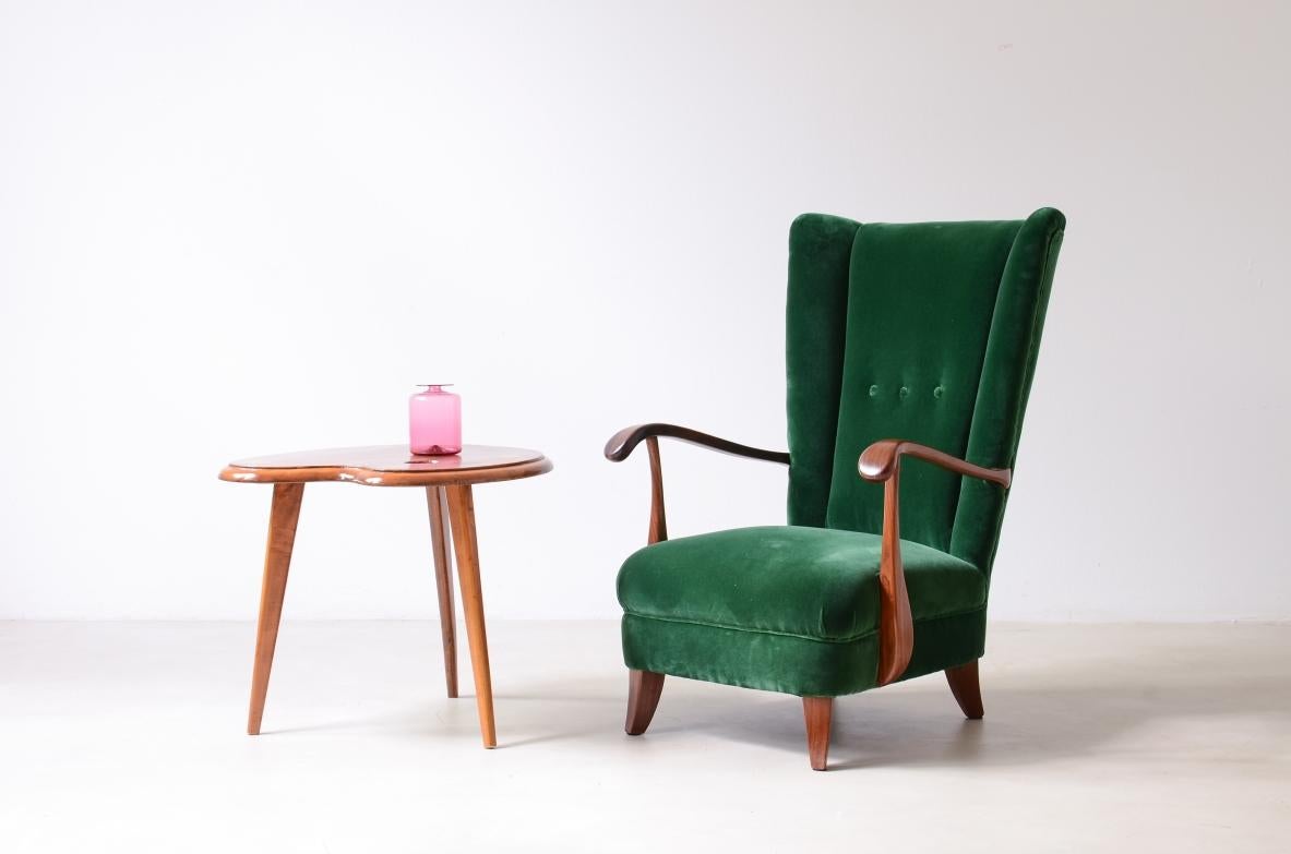 20th Century Lio Carminati, elegant armchair in shaped wood For Sale