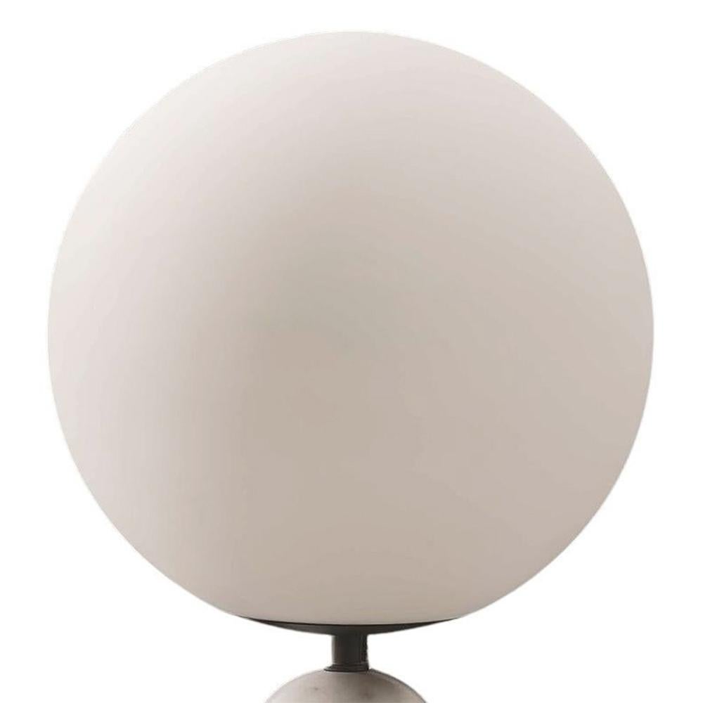 Table Lamp Lio White Medium with white marble
base, metal pole in black finish. With frosted glass
shade, 1 Led bulb, dimmable led lighting, bulb not included.