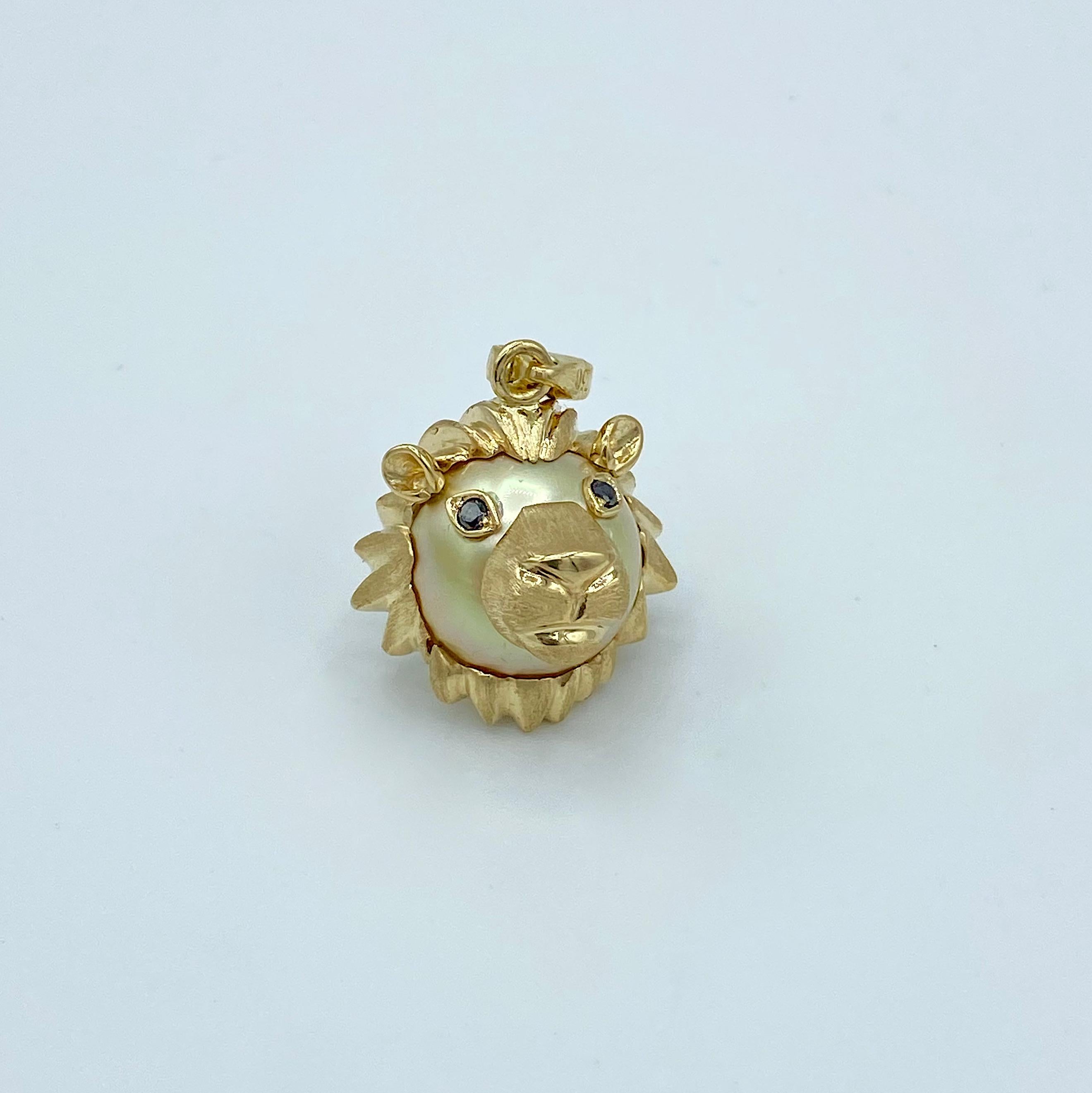 Lion Black Diamond Australian Gold Pearl 18Kt Gold Pendant Necklace or Charm
I used a yellow Australian pearl to create a lion face. I made the mane around the head, nose, mouth and ears in yellow gold. The almond-shaped eyes are set with two round