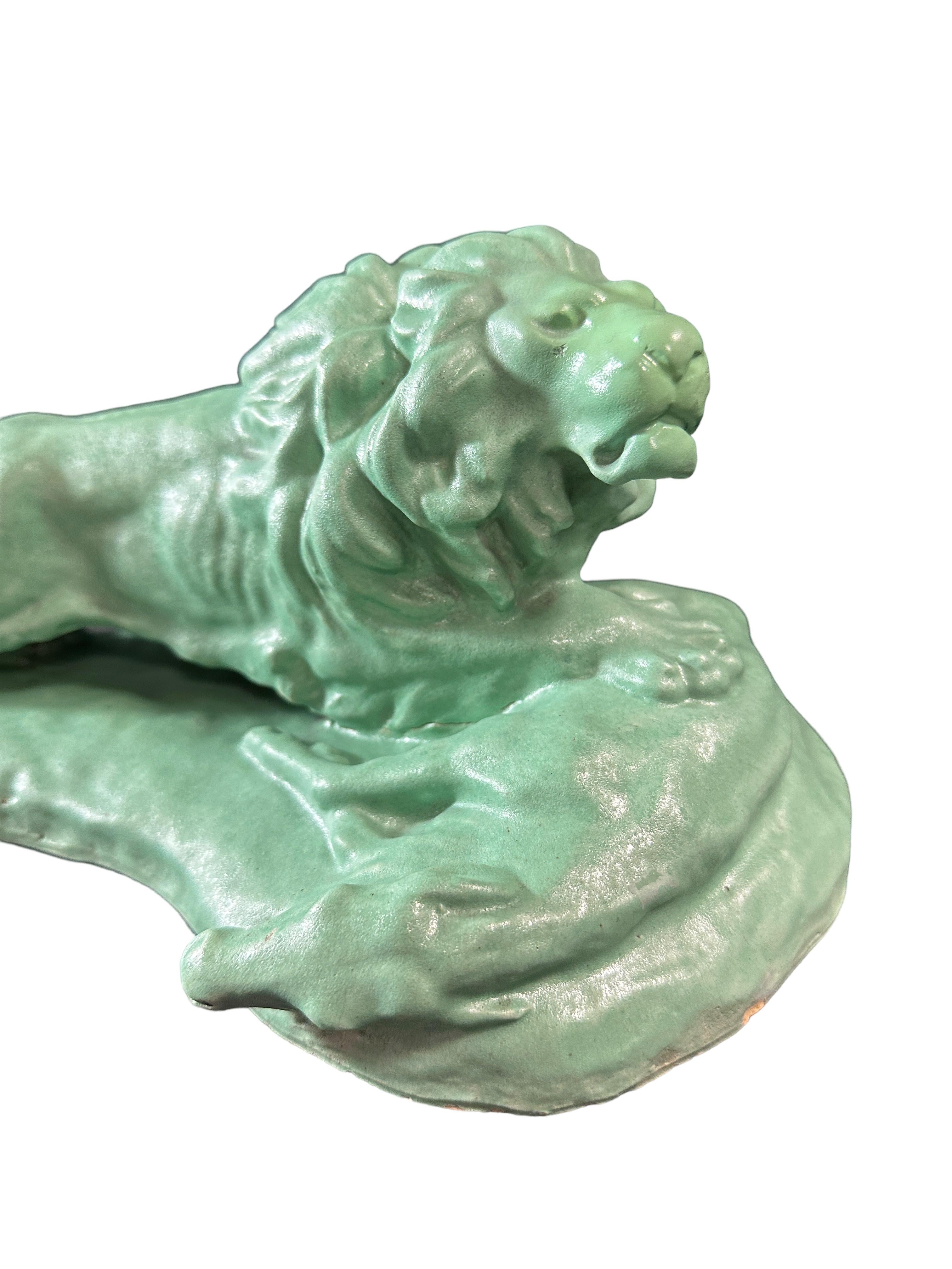A beautiful vintage ceramic glazed lion sculpture. It is marked Jul. Singer, and dated 1937. Small chip at the base like seen in the pictures. found at an Estate Sale in Vienna, Austria. A nice addition to any room. Looks great as a center piece on