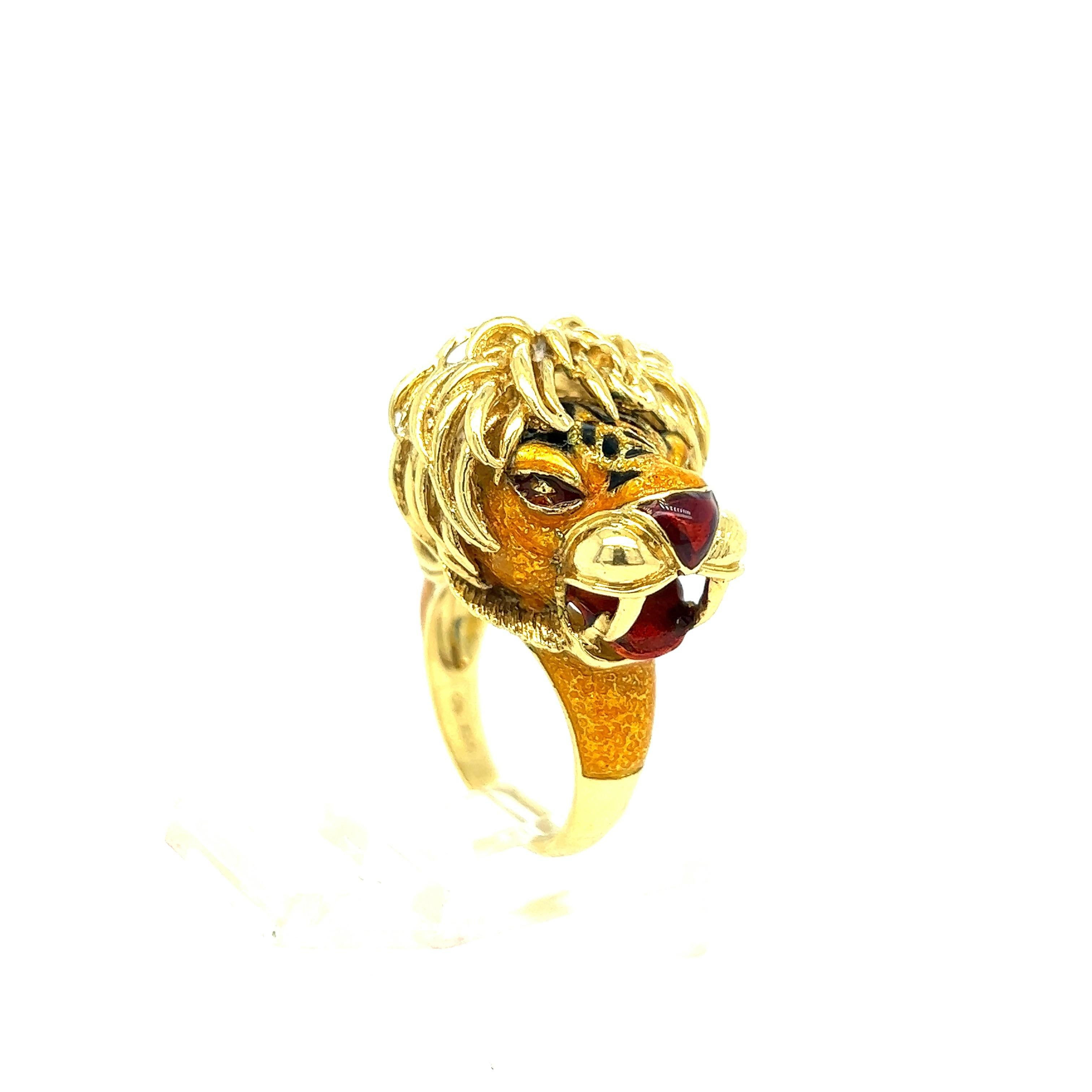18k yellow gold lion head ring, adorned with multi color enamel. Ring size 7, top of the ring overall measures approx. 21mm x 25mm. Hallmarked 750 on the inside. Weight of the piece - 18.4 grams. 