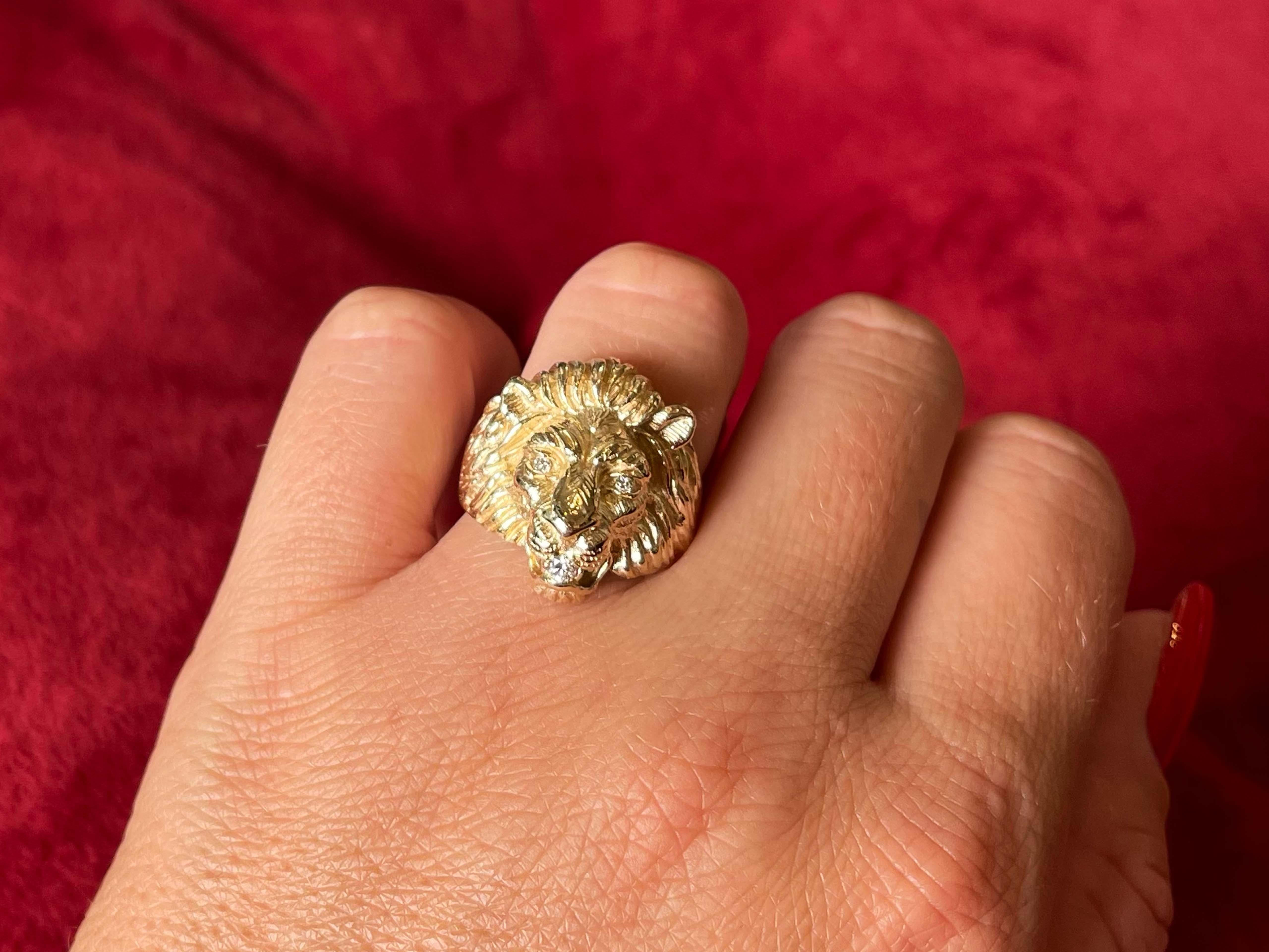 Lion Head Diamond Ring 14K Yellow Gold
​
​Fierce lion head ring with diamond eyes biting a diamond.
​
​Item Specifications:

Metal: 14K Yellow Gold

Total Weight: 11.3 Grams

Ring Size: 7.75
​
​Ring Height: 22 mm tall

Diamond Count: 3 Brilliant cut