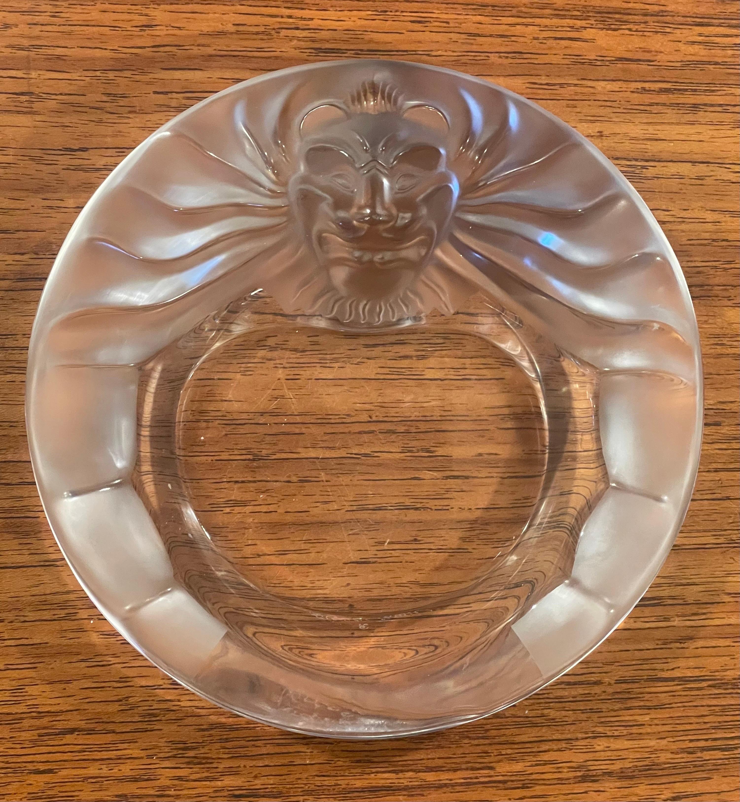 Gorgeous lion head crystal cigar ashtray / bowl by Lalique of France, circa 2000s. This stunning piece features a raised lion head with contrast in clear and frosted texture. The piece measures 5.75