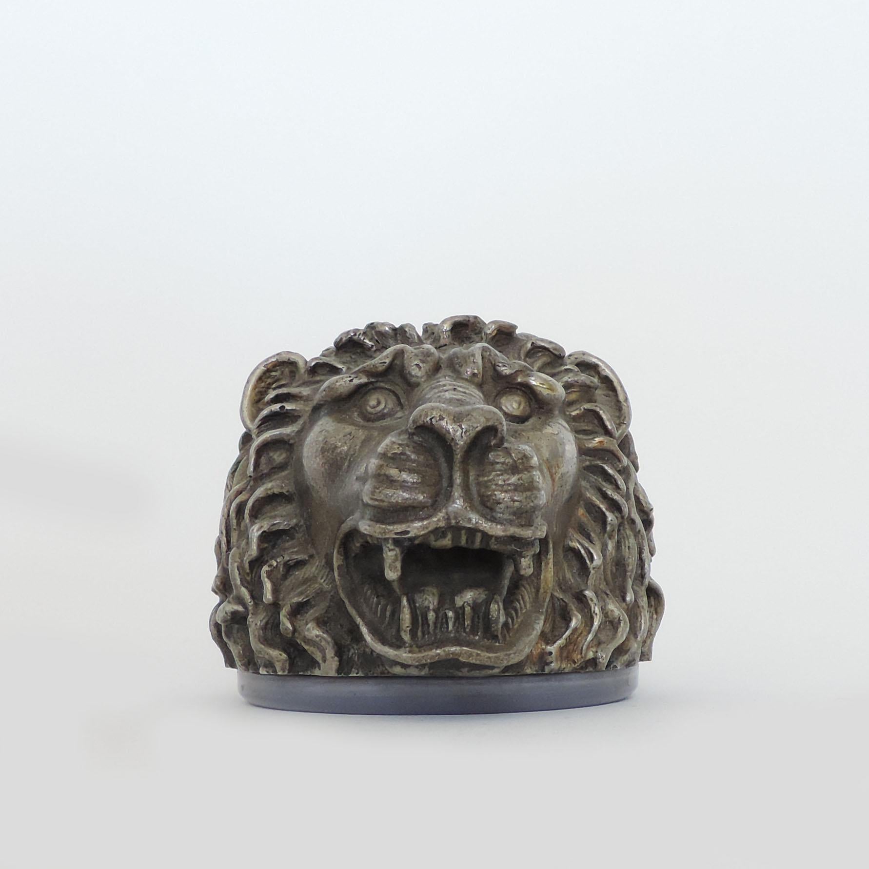 Lion head table lighter in silvered metal, Italy, 1960s.