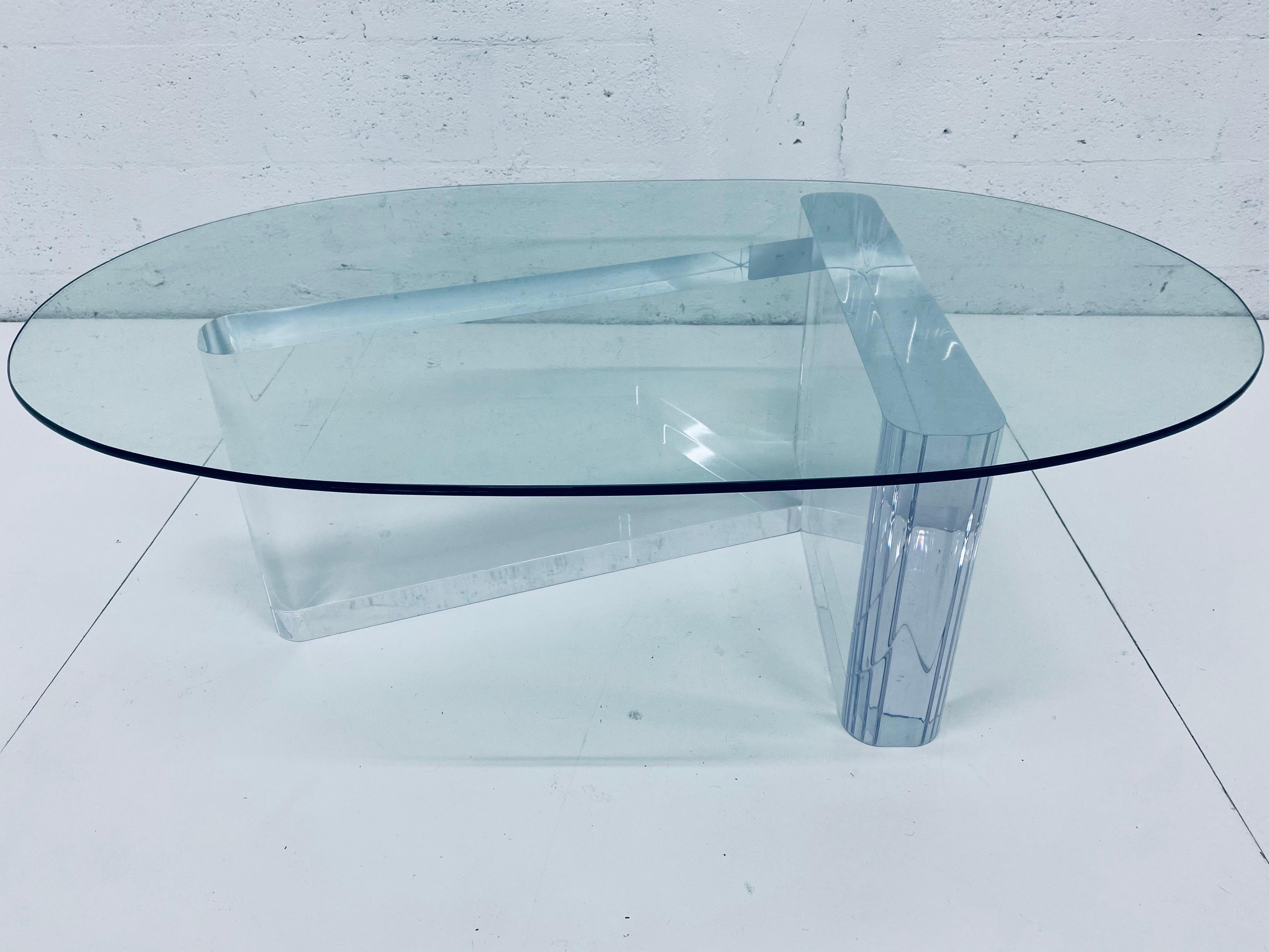Sculptural Lucite coffee or cocktail table base with oval glass top by Lion In Frost from the 1970s, signed. 

Lucite measures 4 inches thick. Use base with existing glass or have a new piece custom made. We can assist with new glass if required.