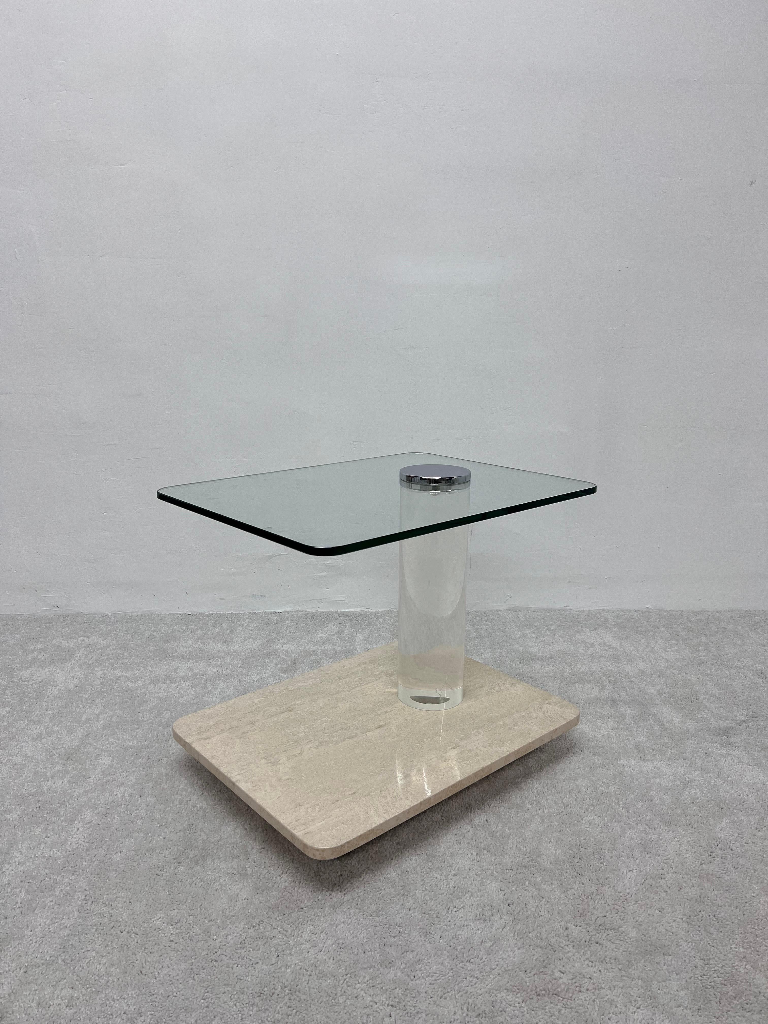 Lion in Frost modern side or cocktail table with lower brass banding, travertine shelf and a cantilevered glass top on a thick lucite column held in place by a polished chrome cap, 1970s.

Table top height: 20