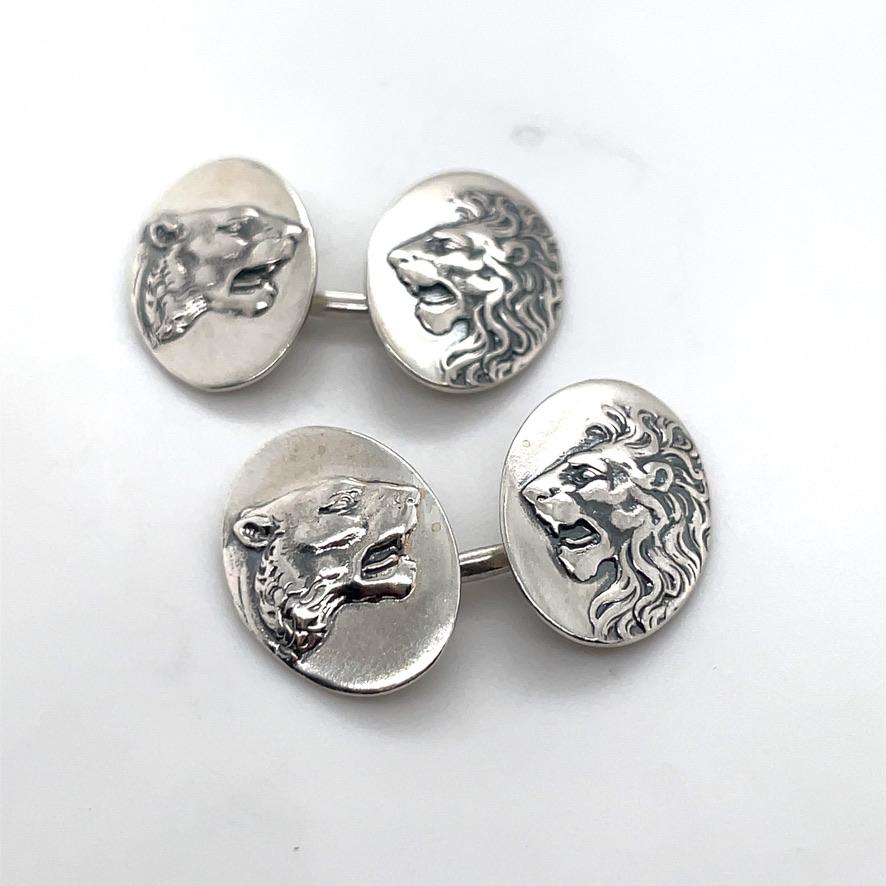 Sterling silver double-sided cufflinks.  One side has an applied lion head; the reverse side has a lioness head.  For the Leo in your life.

Alice Kwartler has sold the finest antique gold and diamond jewelry and silver for over forty years.