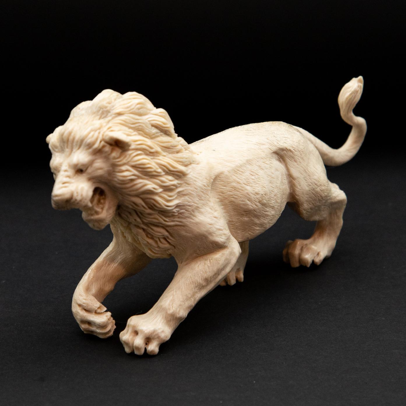 Lion moose antler carving. Detailed moose antler carving of a lion, from Indonesia. This is a one of a kind object. The moose antler was sourced in North America and then sent to Asia for carving. Quality of ivory, but with sustainability, as the