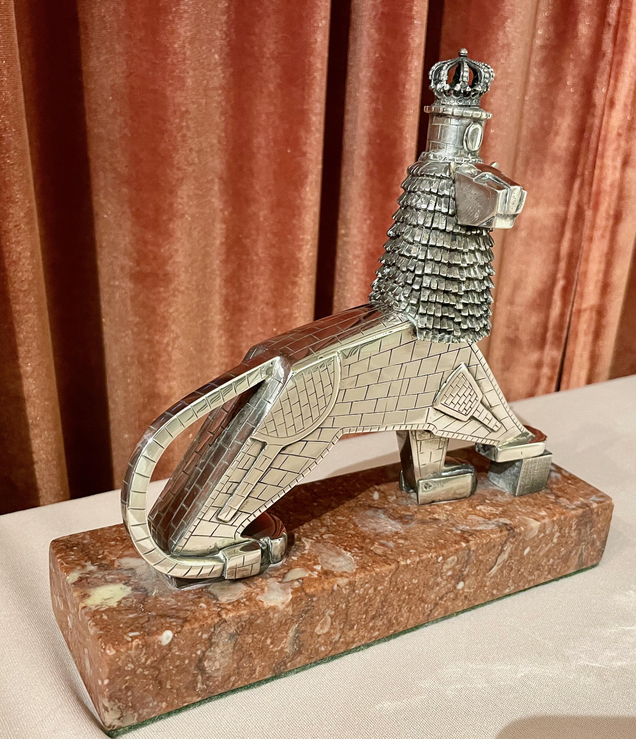 A silver statue called “The Lion of Judah”! Purchased in Israel, signed by the artist K. Dejene based on a larger public sculpture in Addis Ababa, Ethiopia. For all you historians, the monument was erected during the reign of Emperor Haile Selassie