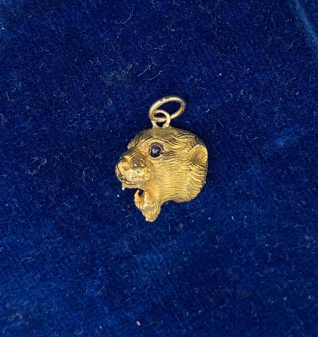A wonderful antique Belle Epoque, Victorian pendant with a beautifully modeled lion, leopard or panther in 14 Karat Gold with one Sapphire and Diamond eye.  We love our panther, lion, cat jewelry and this one has such stunning design.   The engraved