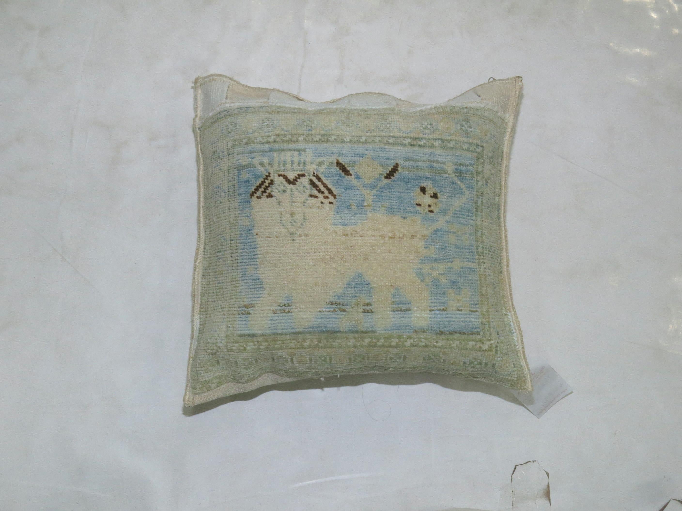 Pair of light blue Persian pillows depicting lions. Measuring 15