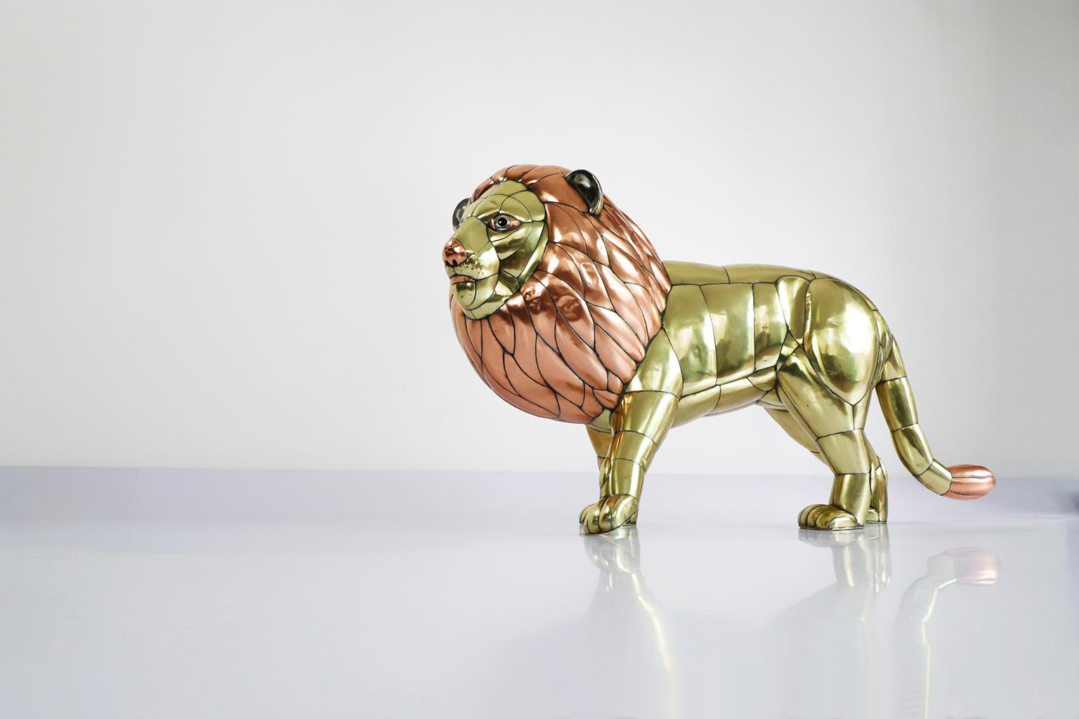 Circa 1970, we offer this Lion Sculpture by Sergio Bustamante, made in Bronze and copper elements, cut bent and assembled.

Sergio Bustamante is a Mexican Artist and sculptor. He began with paintings and papier mache figures, inaugurating the