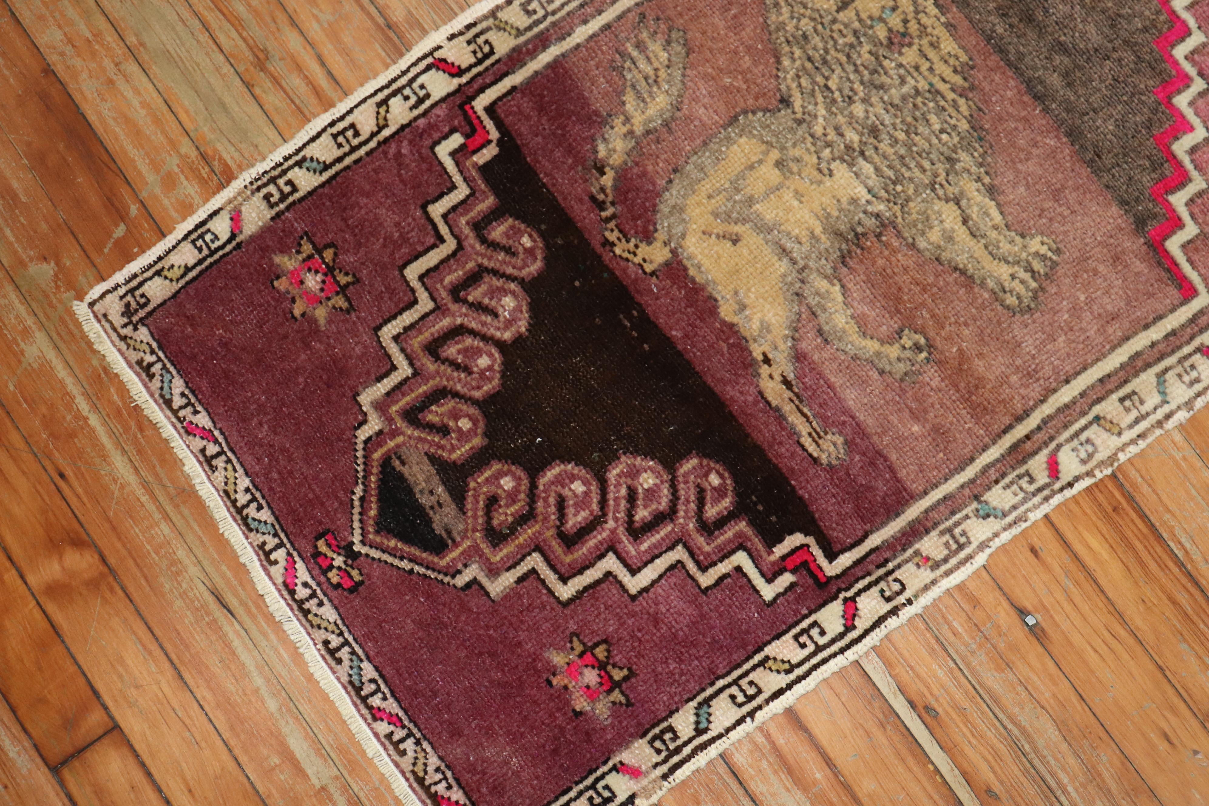 A mid-20th century authentic Turkish rug depicting a lion on a striated purple ground.

Measures: 1'10