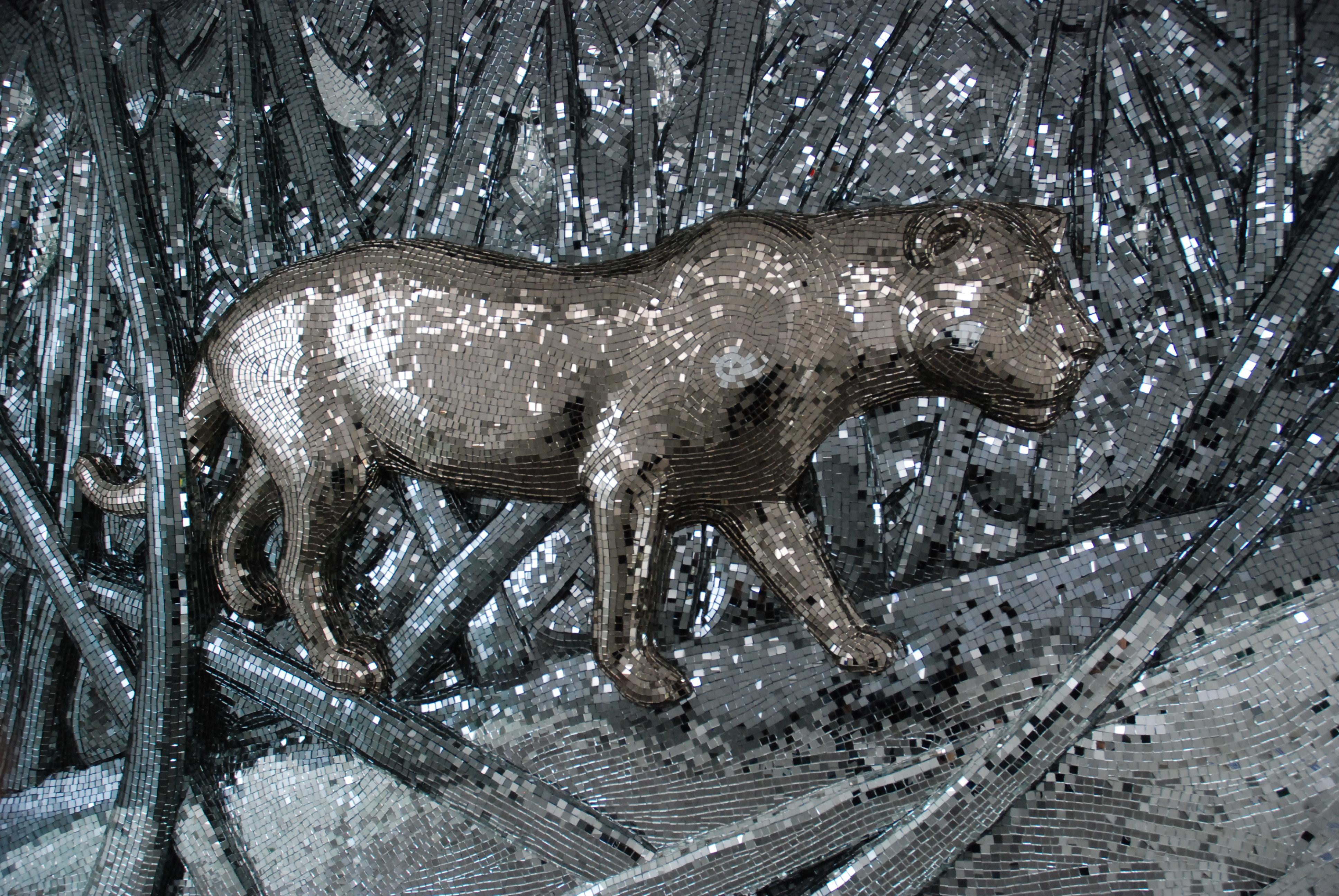 Lioness In The Forest by Davide Medri
Dimensions: W 300 x D 20 x H 200 cm (dimensions may vary)
Materials: Mirror Mosaic

Davide Medri was born in Cesena on August 7th 1967 and graduated at the Academy of Fine Arts in Ravenna, the Gino Severini