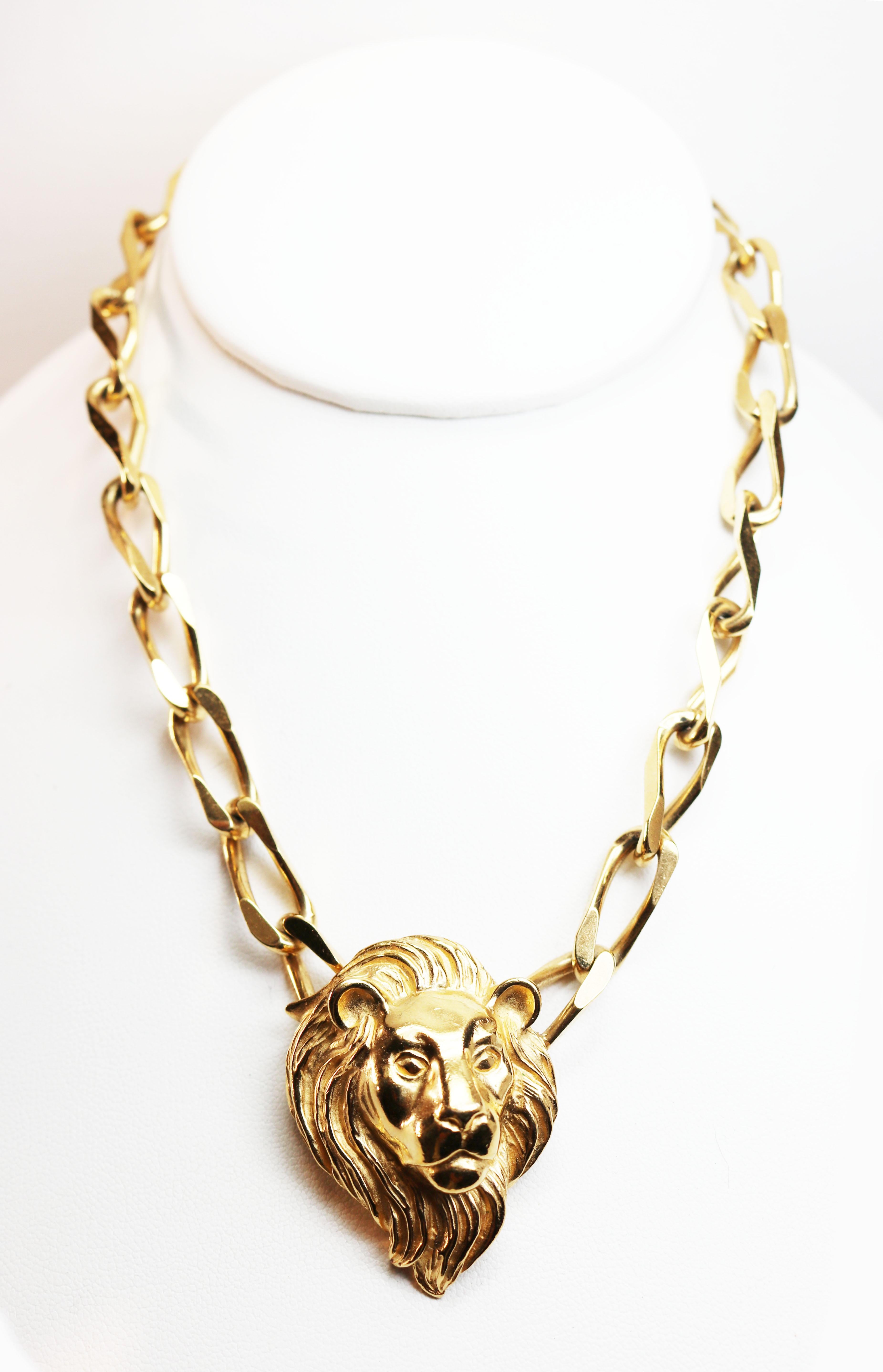 Napier lion's head choker length necklace is gold plated and has a very unique clasp which is on the charm itself. 
Trifari designed this imperial piece of jewelry which is choker length and quite stunning. This gold plated pendant necklace is