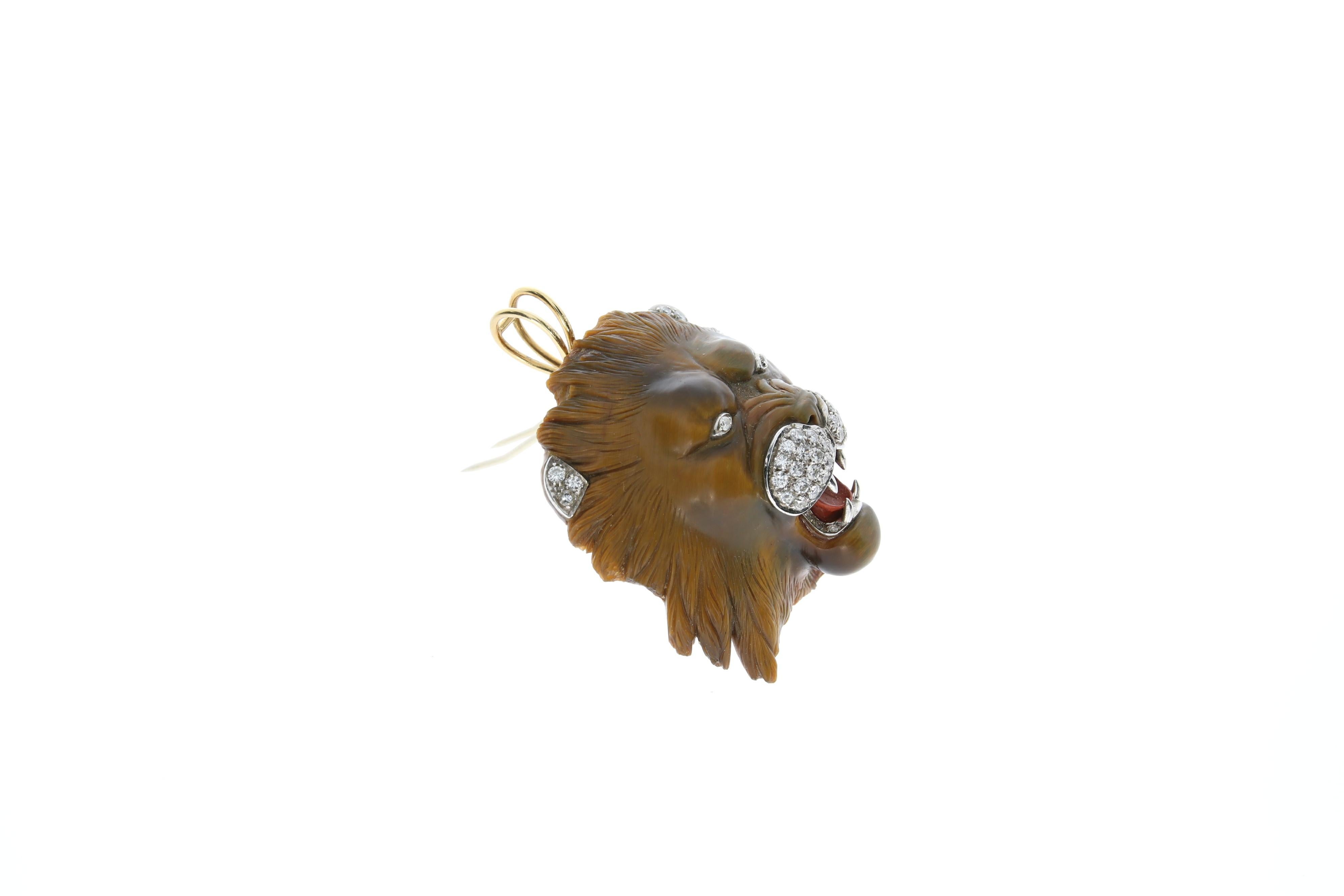 Contemporary Lions Head Pendant/Brooch carved in Tiger Eye Stone For Sale