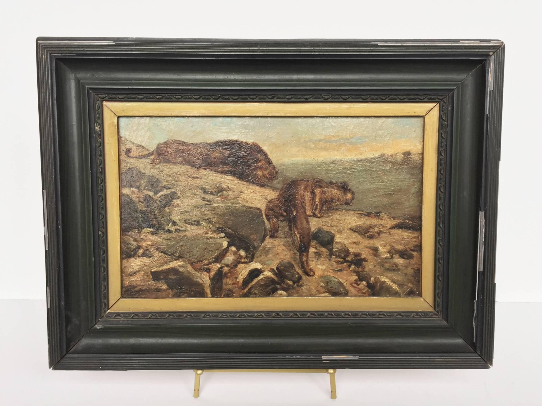 This tense landscape oil painting was completed in the early 20th century. It is signed Montoya at the bottom left. Besides this signature, not much else is known about the painter. The landscape portrays two lions, poised atop a craggy terrain,