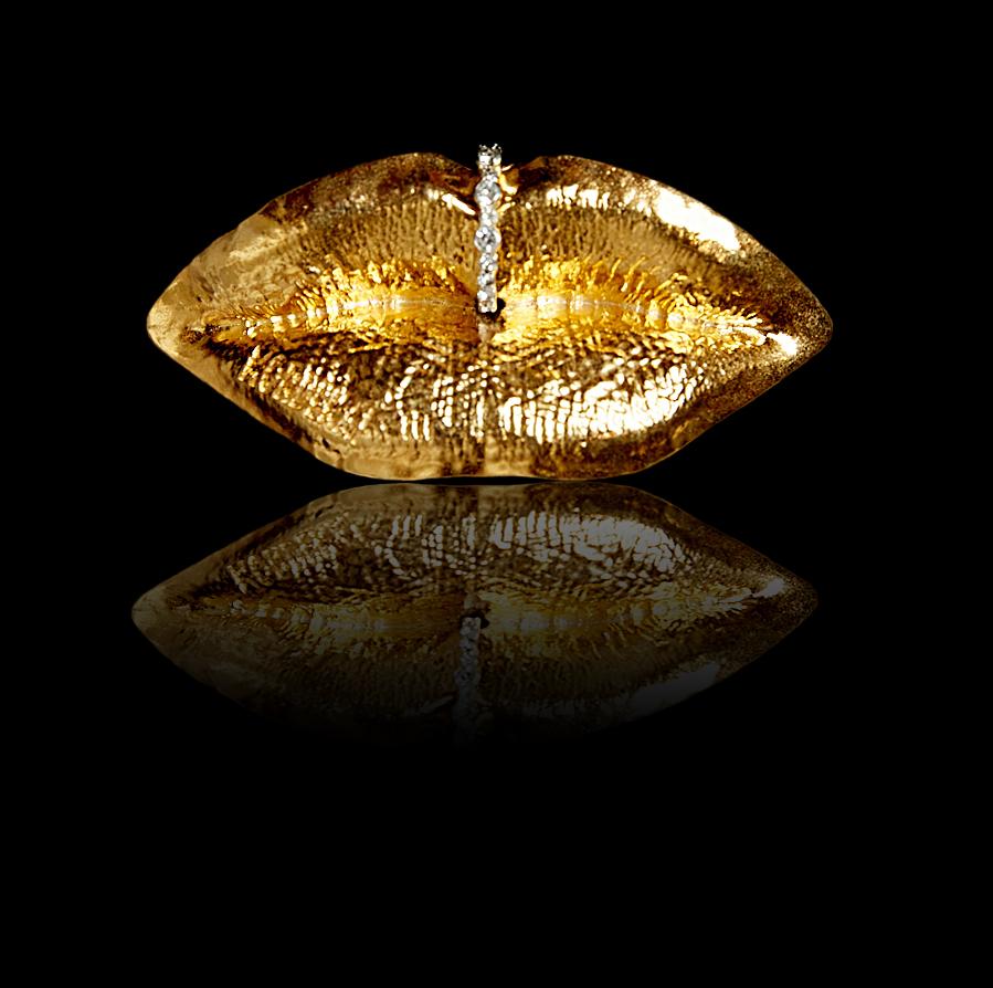 Wear your lips on your sleeve and Whisper. Shout. Kiss. The lips are one of the sexiest features of the face. Available in 24k yellow gold, white gold, and rose gold finish on 3d printed brass lip ring bejeweled lips and cuff. Make everyone kiss
