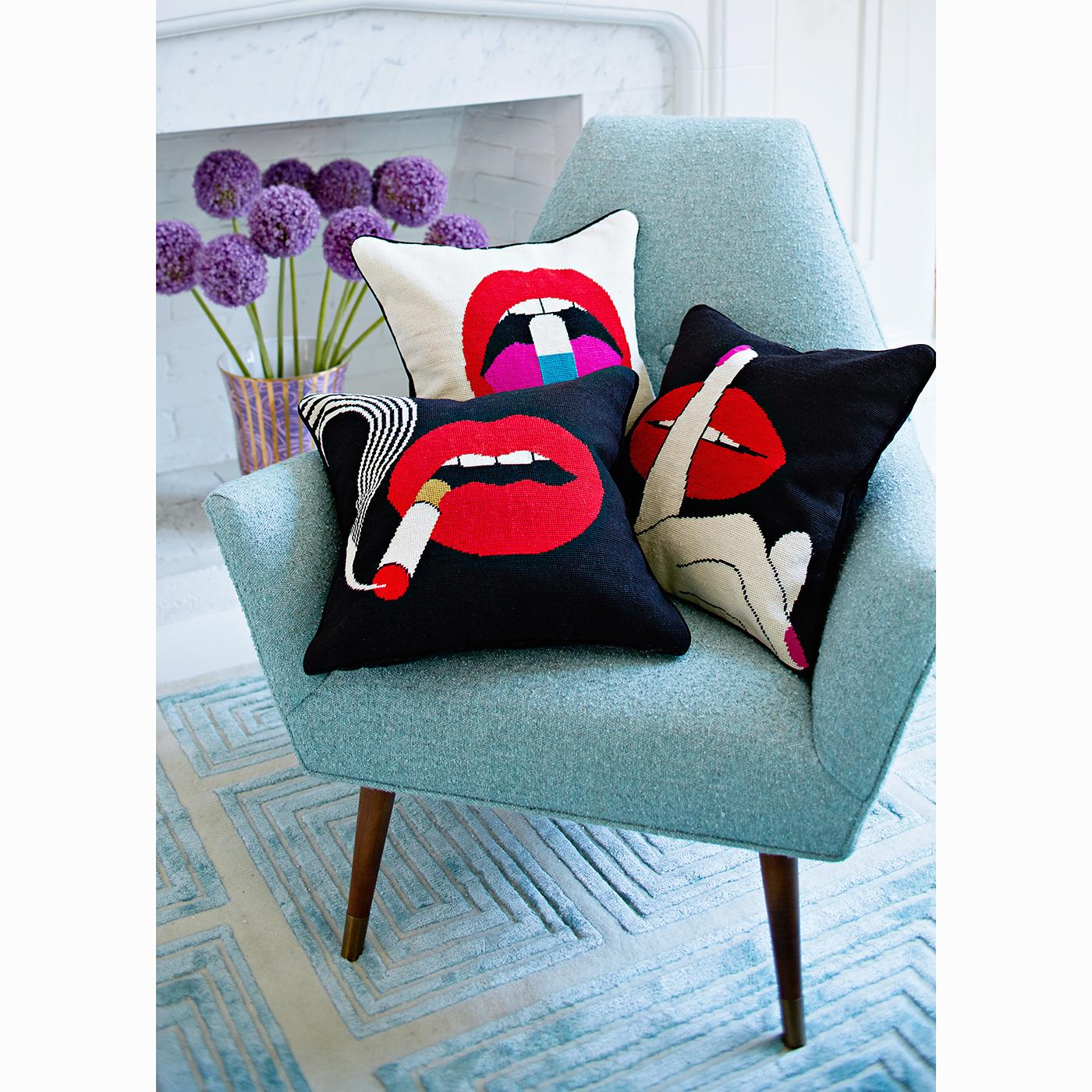 Lip Service. Trippy motifs put your sofa in a trance. Bold red lips demonstrate a trio of vices (or virtues, depending on who you ask).

A marriage of traditional and Mod style, our lips needlepoint pillows are the perfect punctuation for your