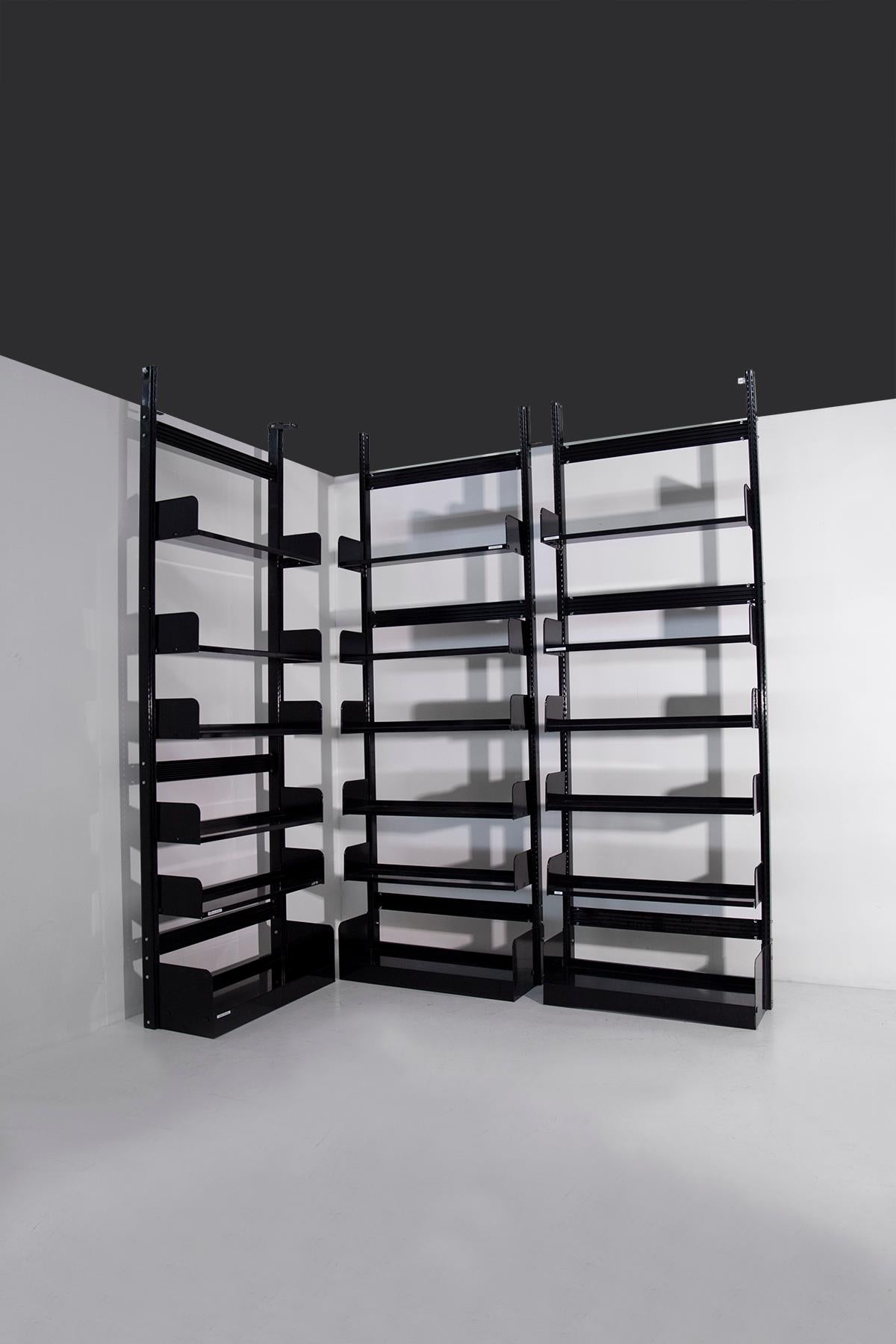Lips Vago's trio of black Congress bookcases from the 1960s exude an aura of timeless sophistication and functional elegance. These bookcases, made of elegant black painted metal, are iconic symbols of the ingenuity and practicality of design from