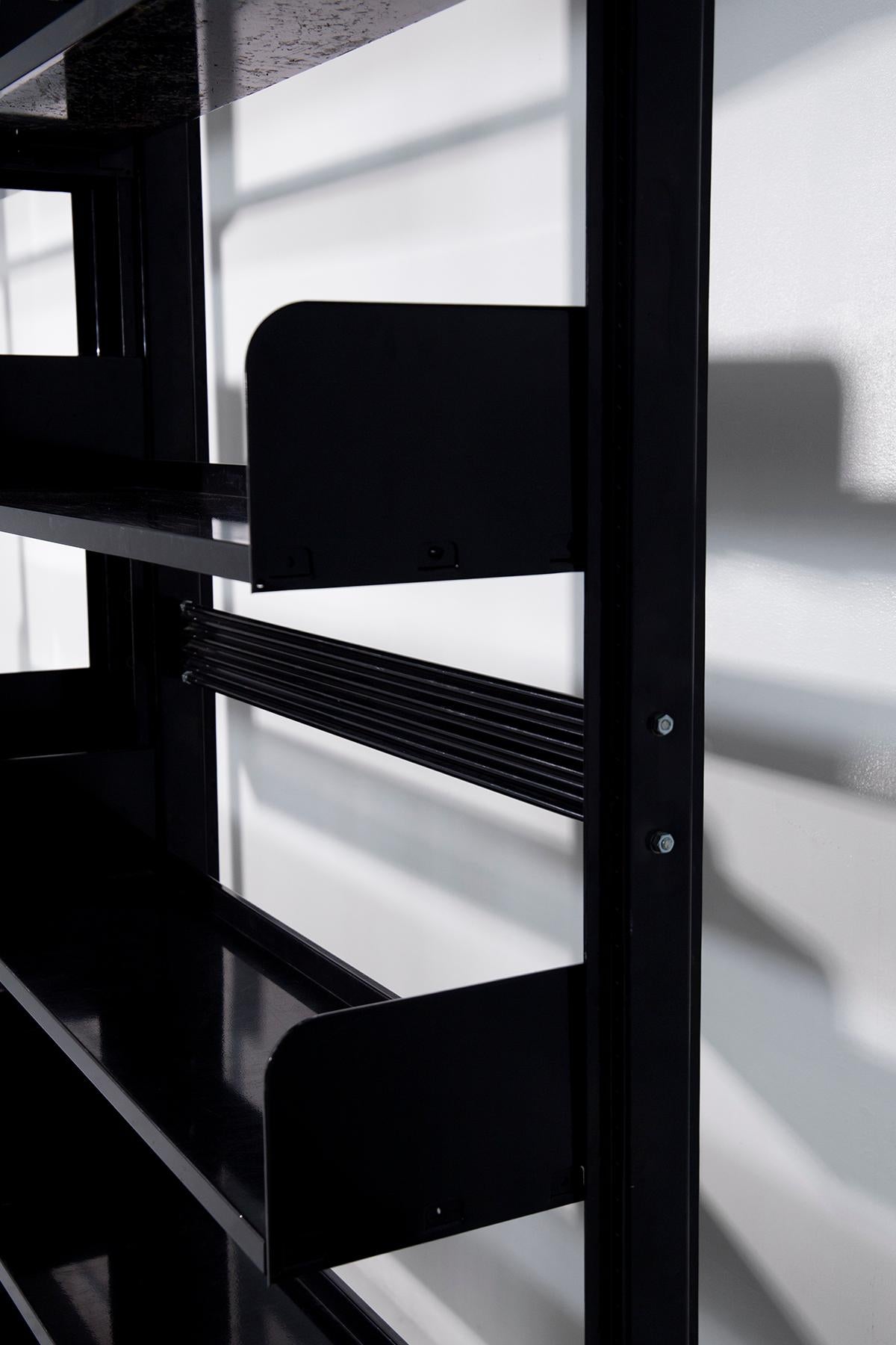 Lips Vago's trio of black Congress bookcases 3