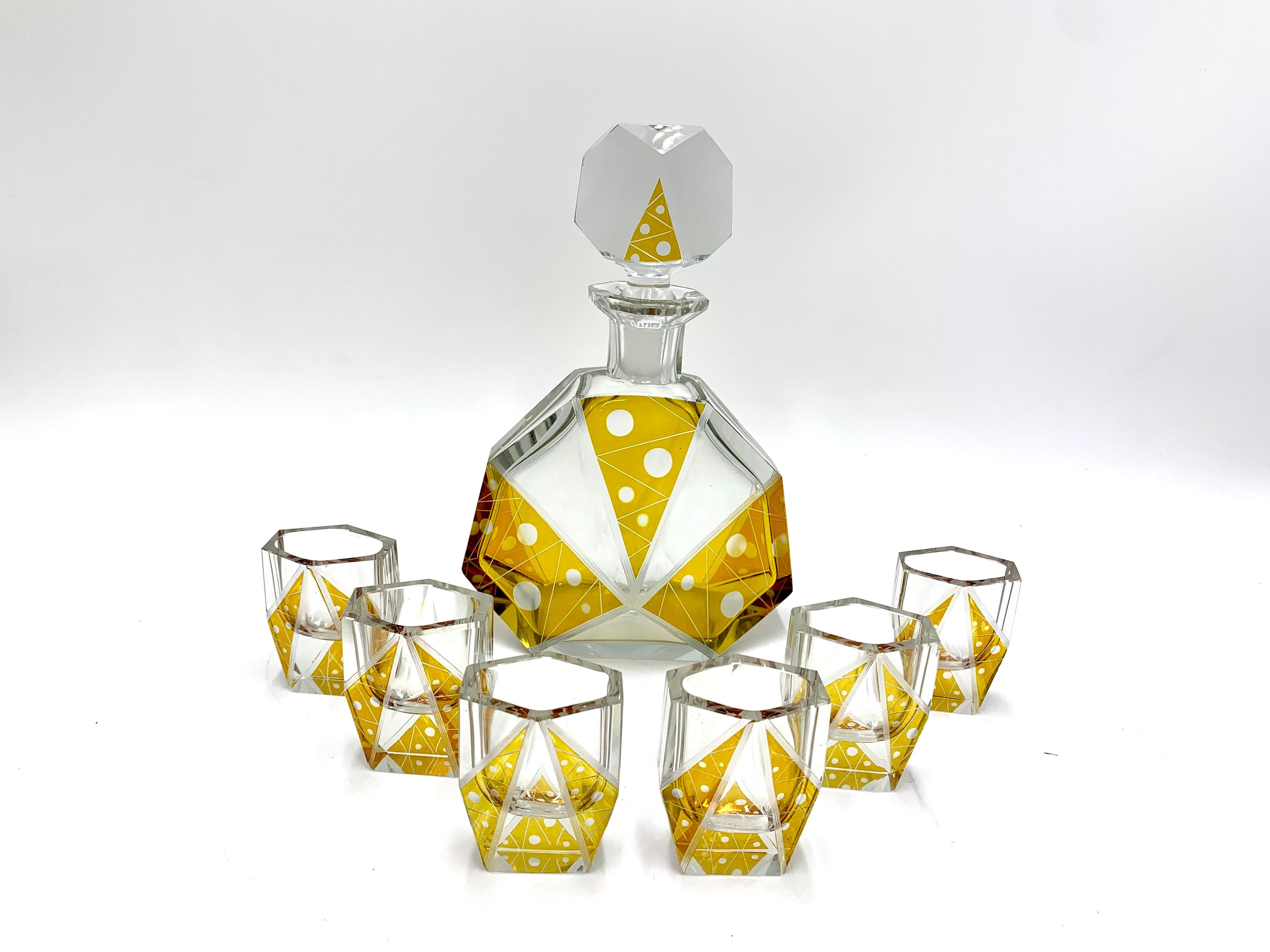 Art Deco crystal liqueur set produced in the Czech Republic in the 1930s by the Ludwik Moser Artistic Glass Factory. A decanter signed Moser.

The set is in very good condition, no damage.

Measures: The height of the decanter with a cap 22 cm,