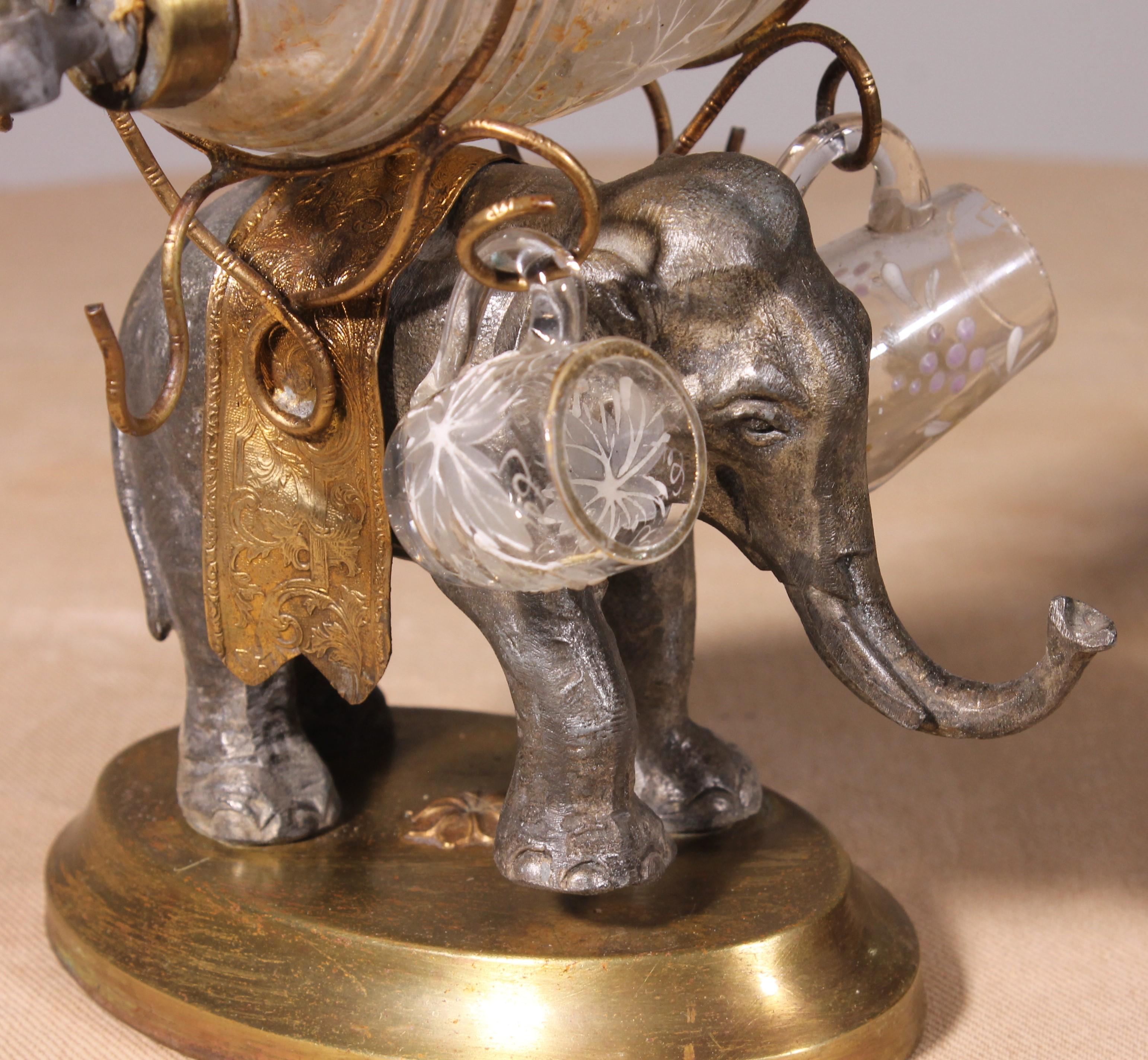 Liqueur cellar with an elephant in spelter, brass and enameled glassware from the Napoleon III period

Beautiful liqueur cellar with a very beautiful elephant decorated with a chiseled brass cape

The elephant is topped with a glass barrel decorated