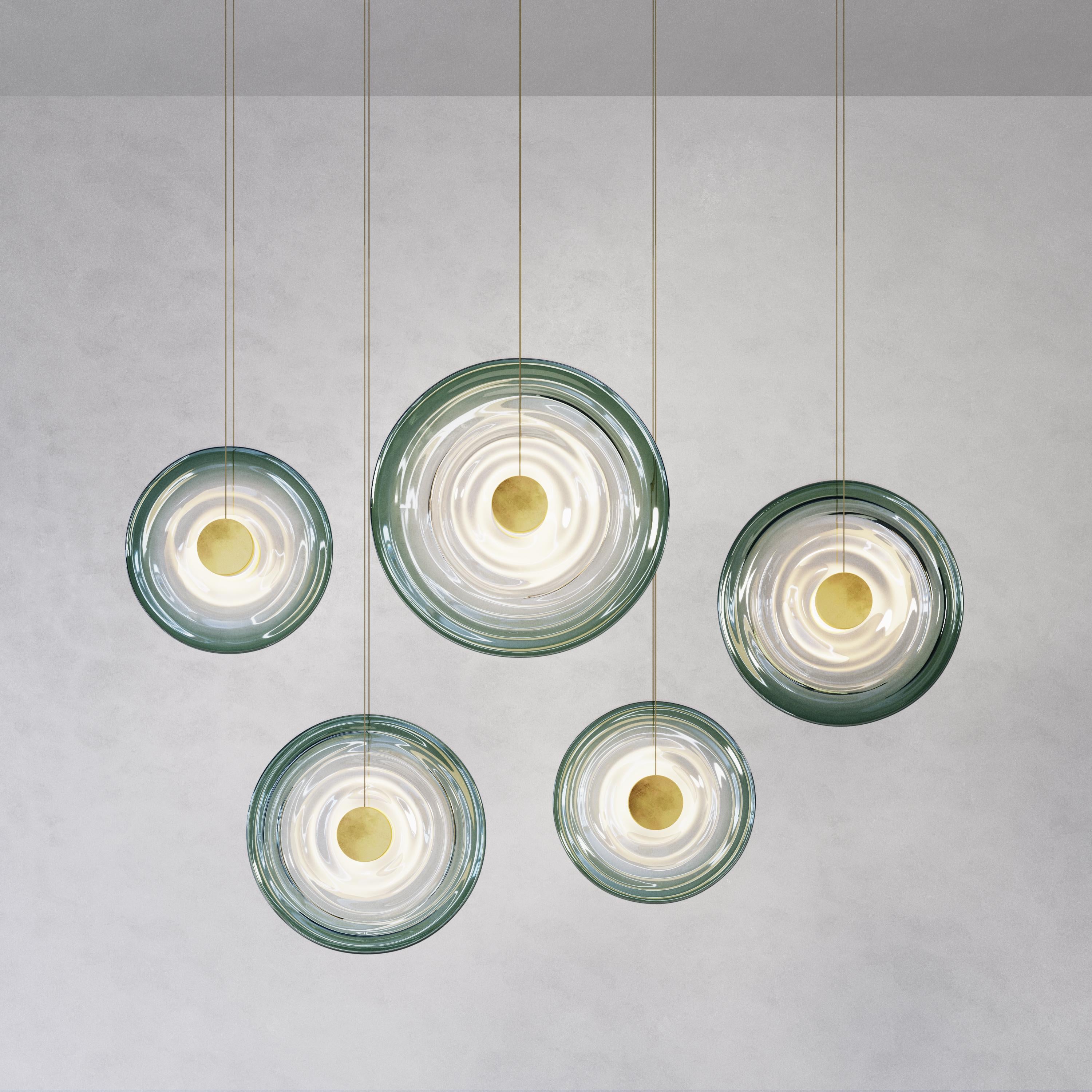 Inspired by water ripples and reflections, each Liquid glass shade is handmade by a London-based master glassblower with decades of experience in glassmaking. Small variations in the shape and edge details are evidence of hand-forming, an authentic,