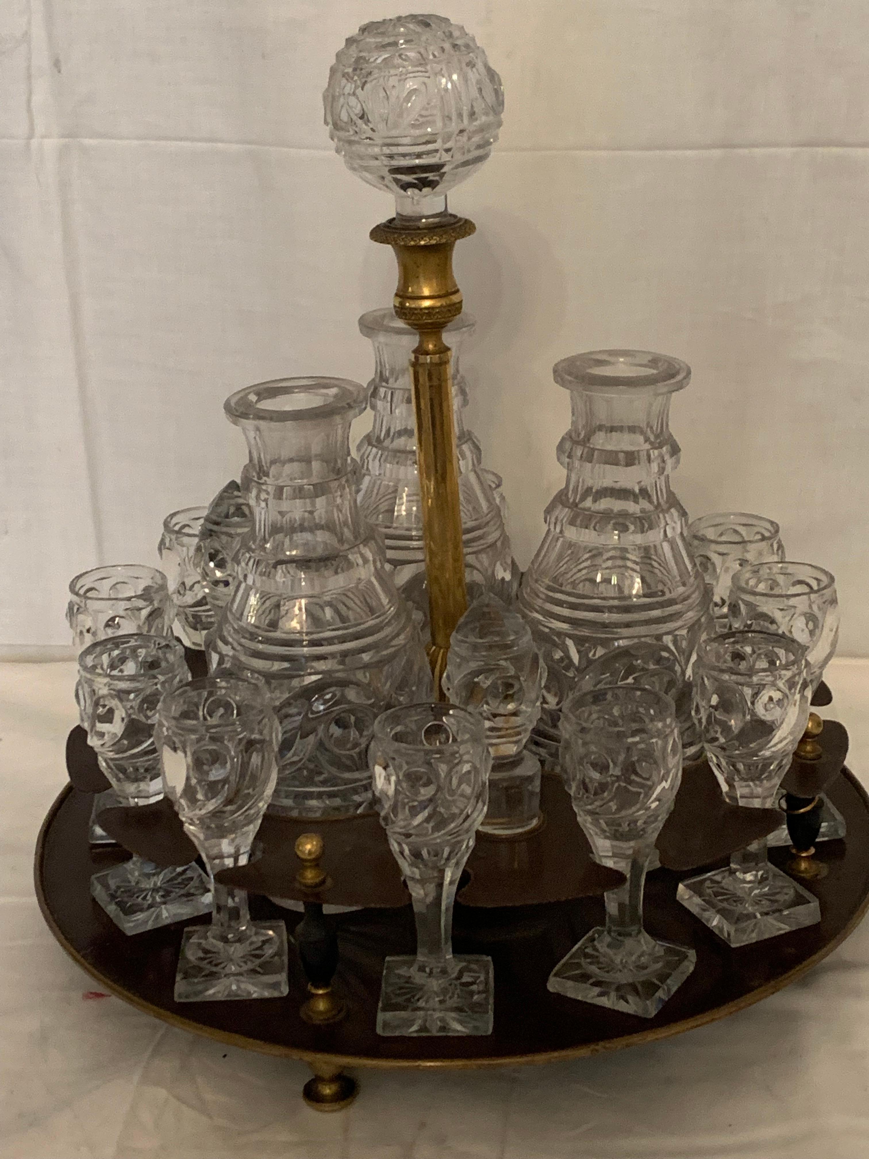 A liquor cabinet in crystal, bronze louis XVI style. High quality of crystal baccarat,in mint condition, unusual by its form ,very elegant ,all the pieces of crystal are original, you have twelve glass and three bottle with the crystal cap, each
