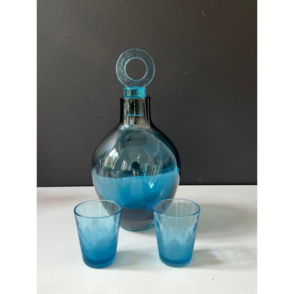 Truly unique glass liquor decanters that will style your bar like no other. Each piece of this glass barware is custom made, mouth blown using two attractive colors that blend into each other.

Handmade by Feleksan Onar, a prominent glass artist